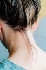 The back of a woman's head with her hair in a bun