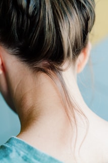 The back of a woman's head with her hair in a bun