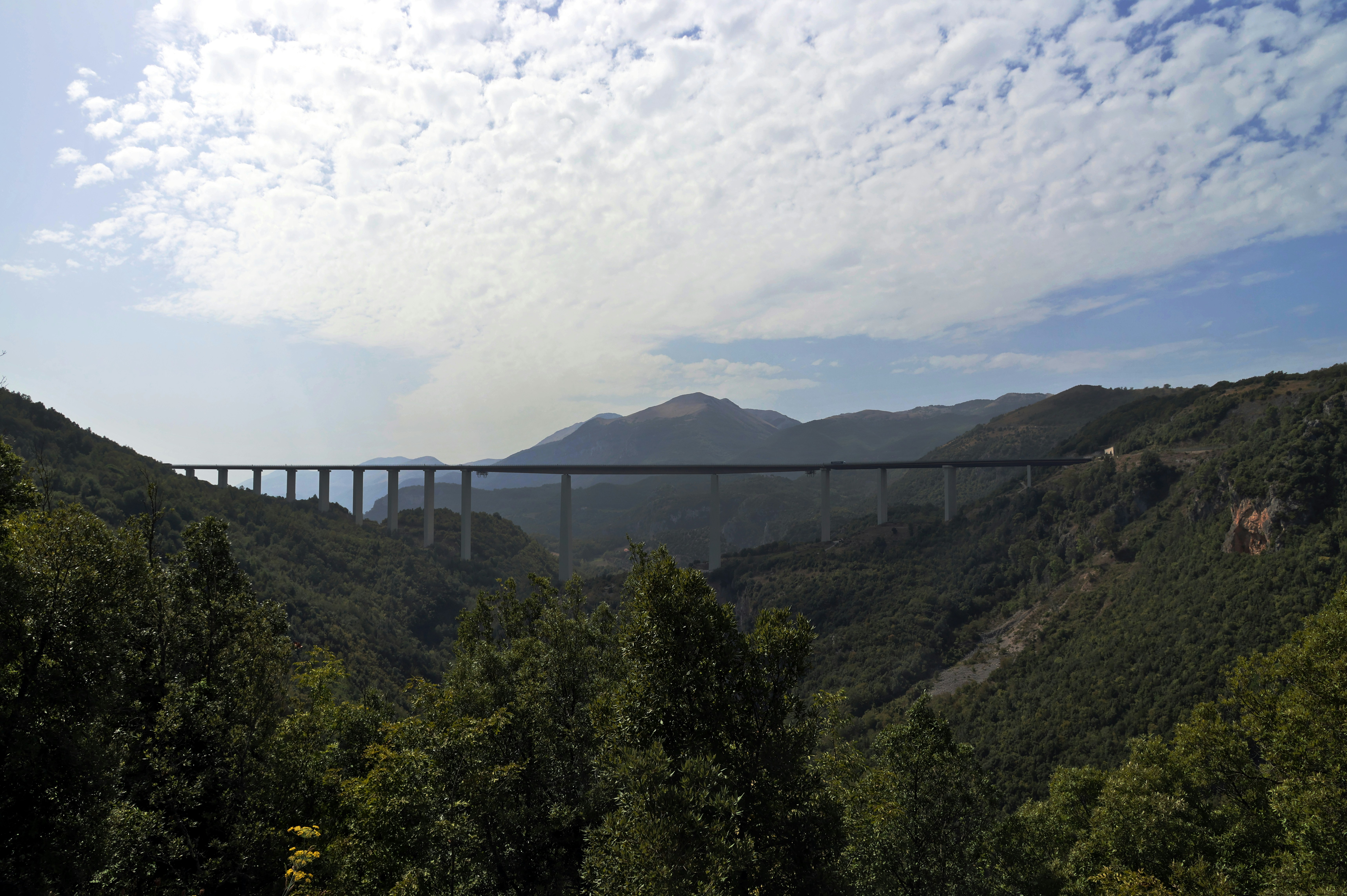 An impressive bridge spanning a vast canyon, showcasing modern engineering.