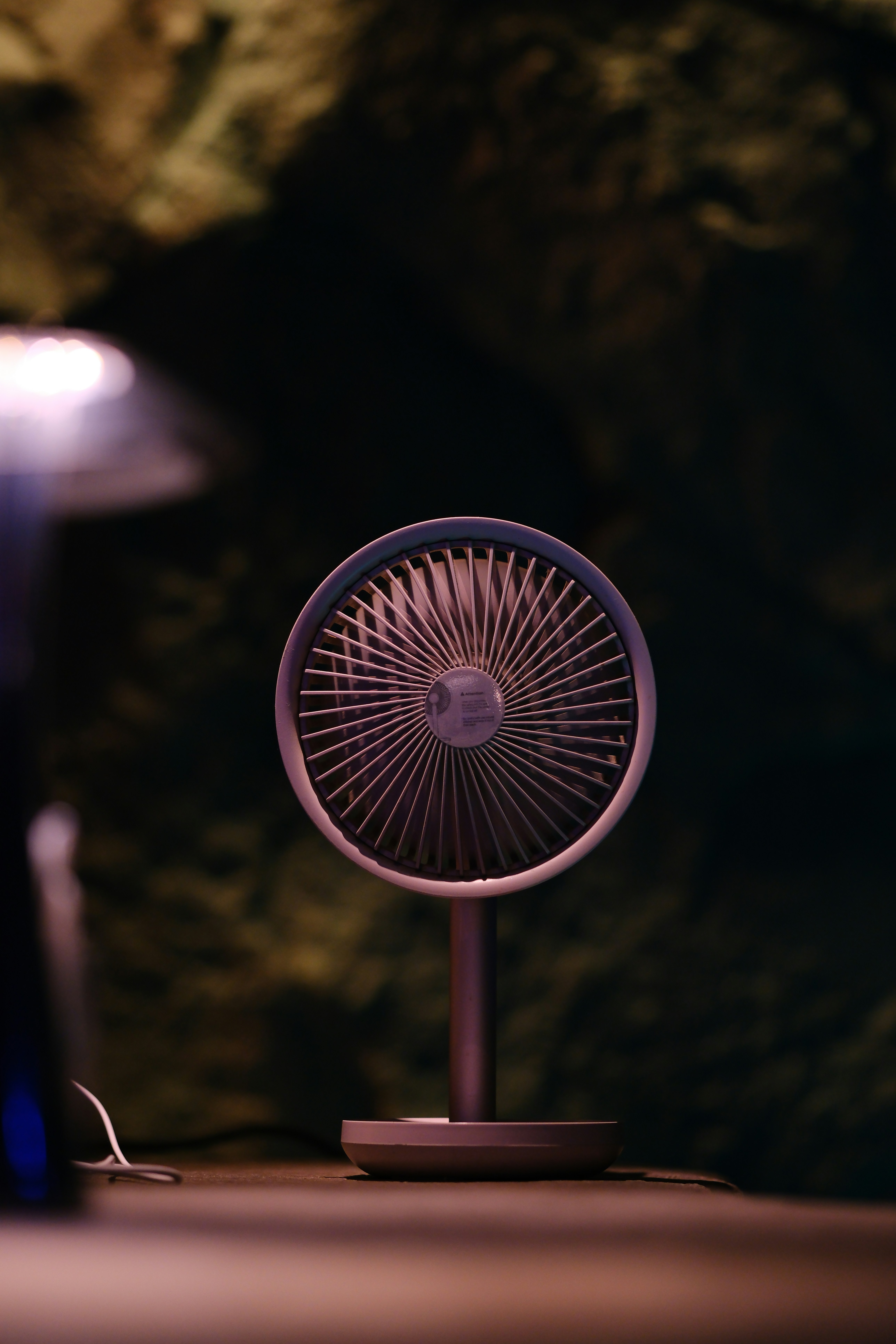 A small fan sitting on top of a table