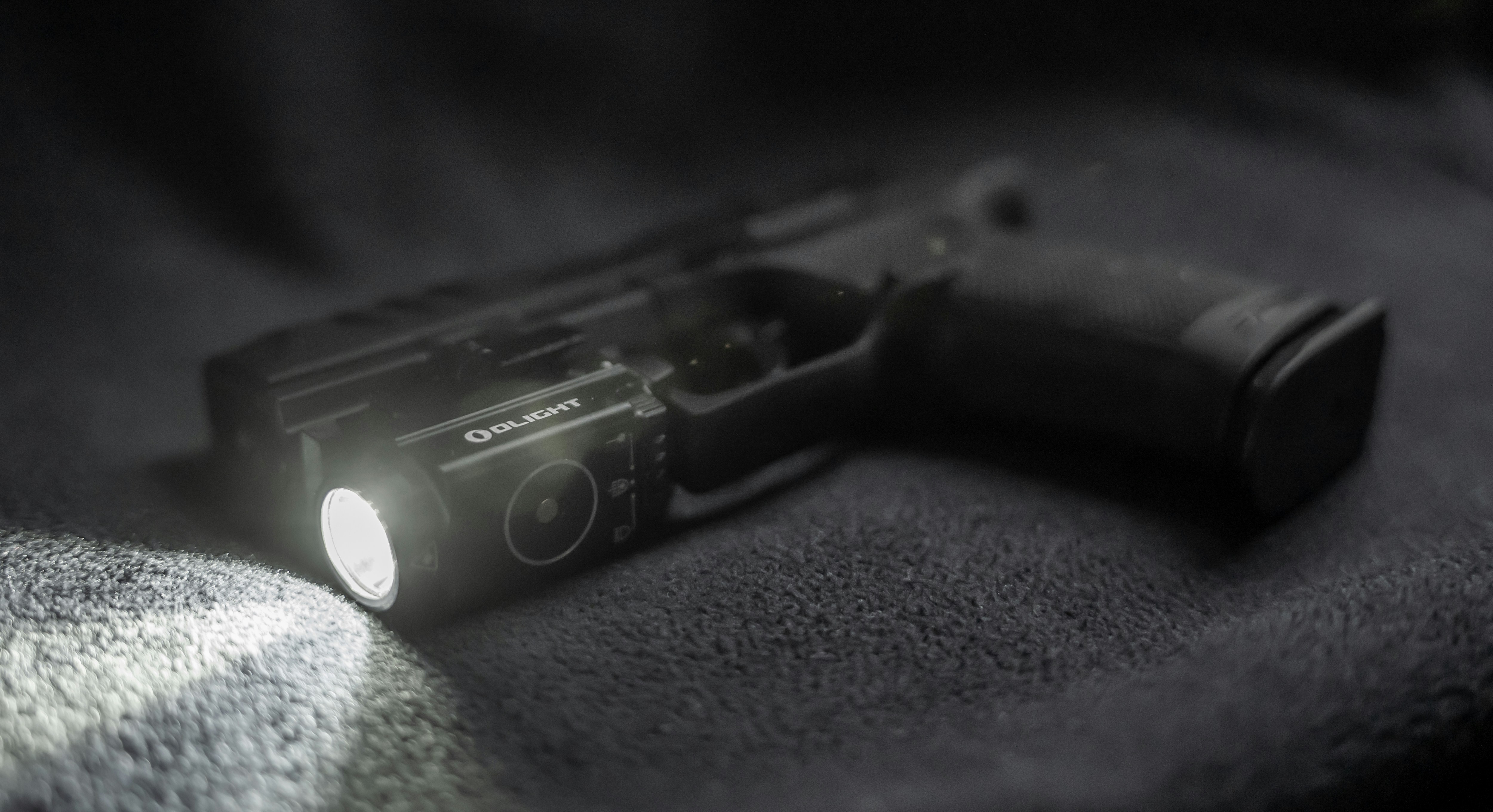 Elite compact tactical item on dark slate surface, sharp focus, industrial environment