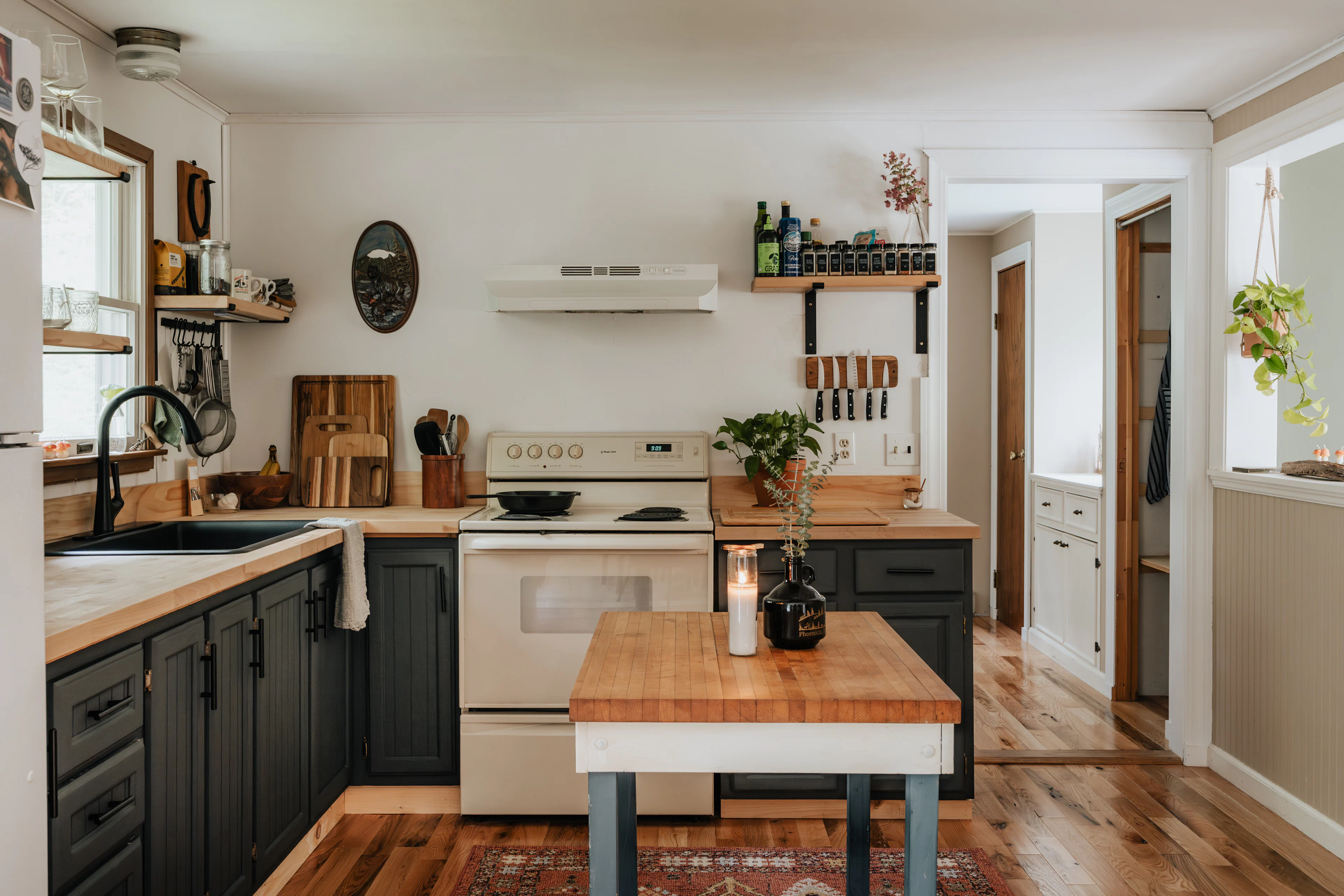 Kitchen with a wooden worktop and open shelves