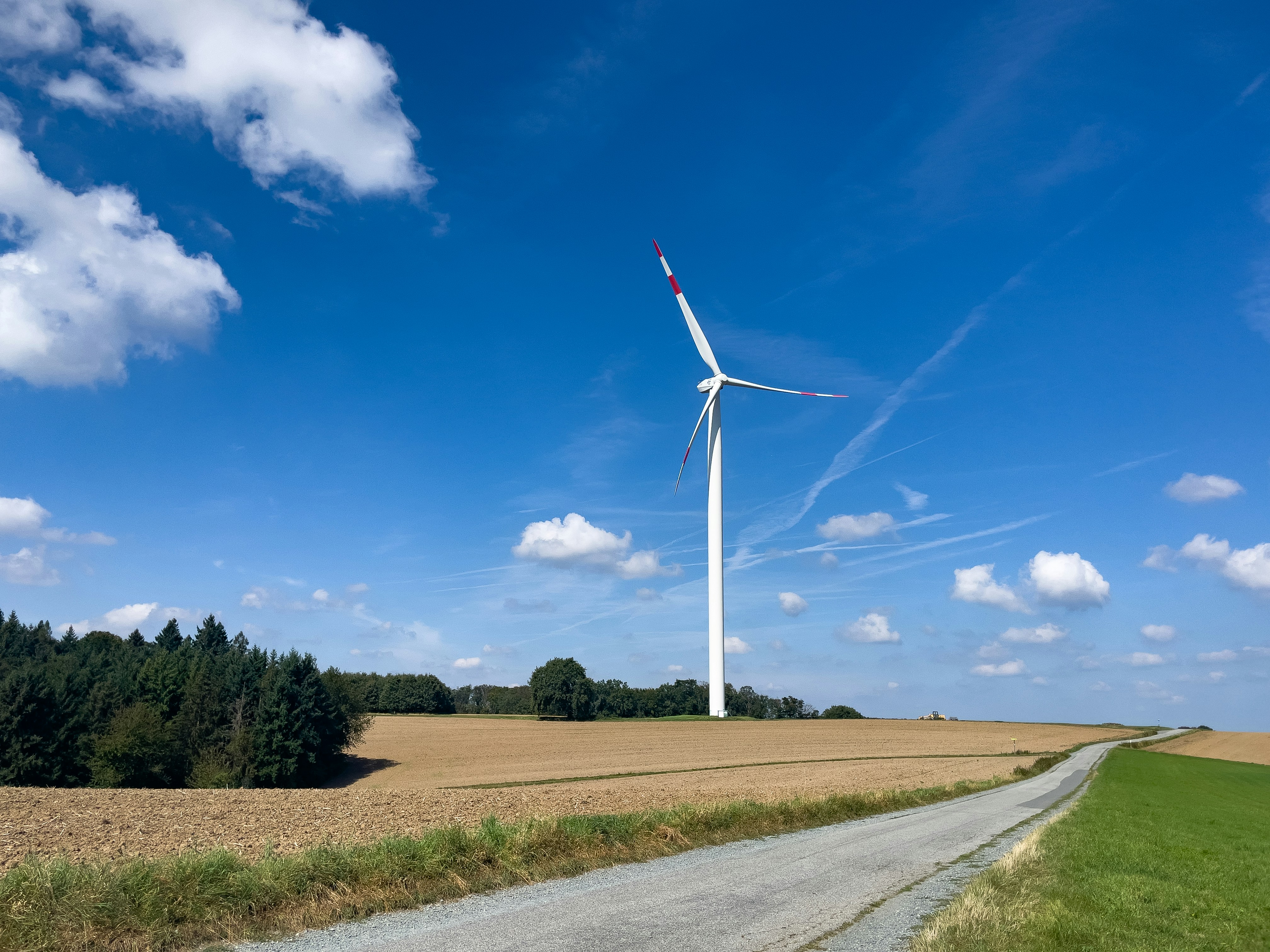 A wind turbine in the middle of a wheat field