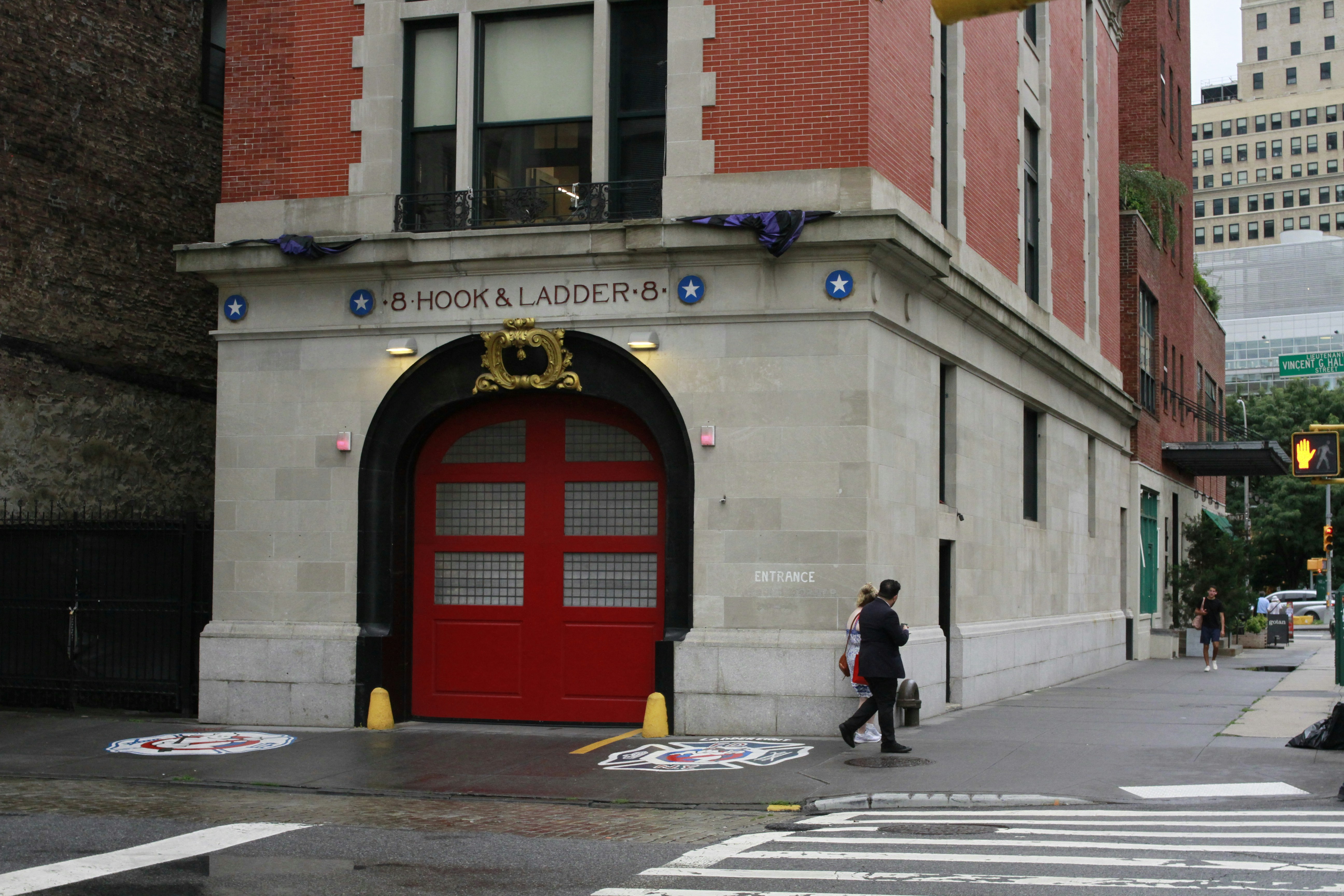 A red fire hydrant sitting on the side of a road