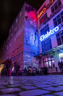 A group of people standing outside of a building
