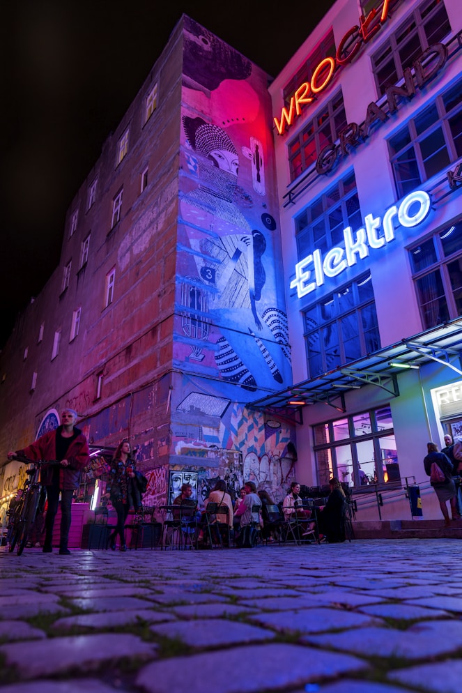A group of people standing outside of a building