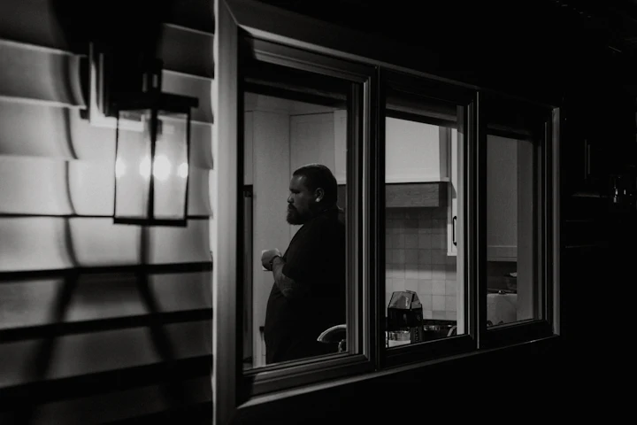 Man looking out of a train window