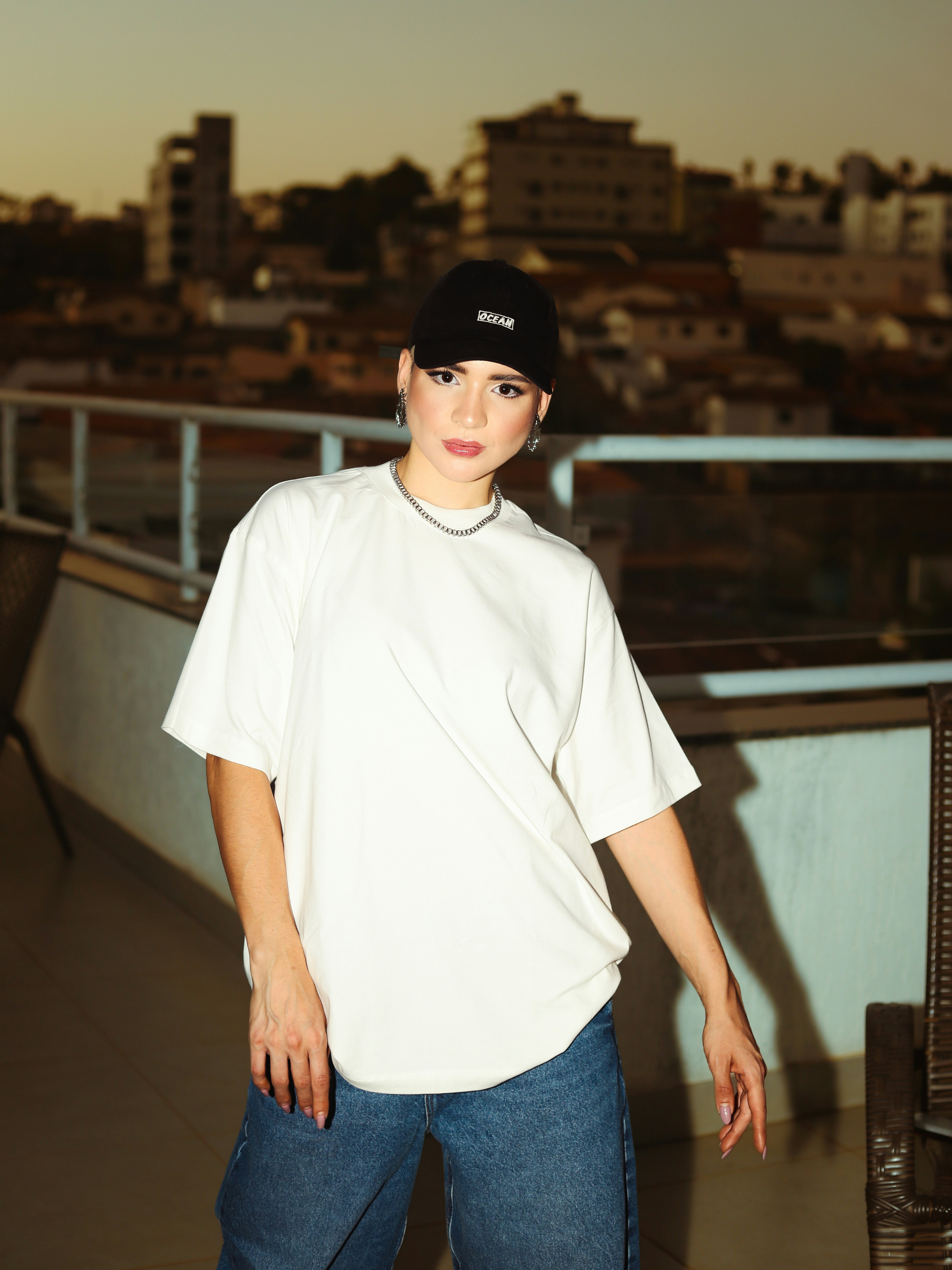 A woman standing in front of a city skyline