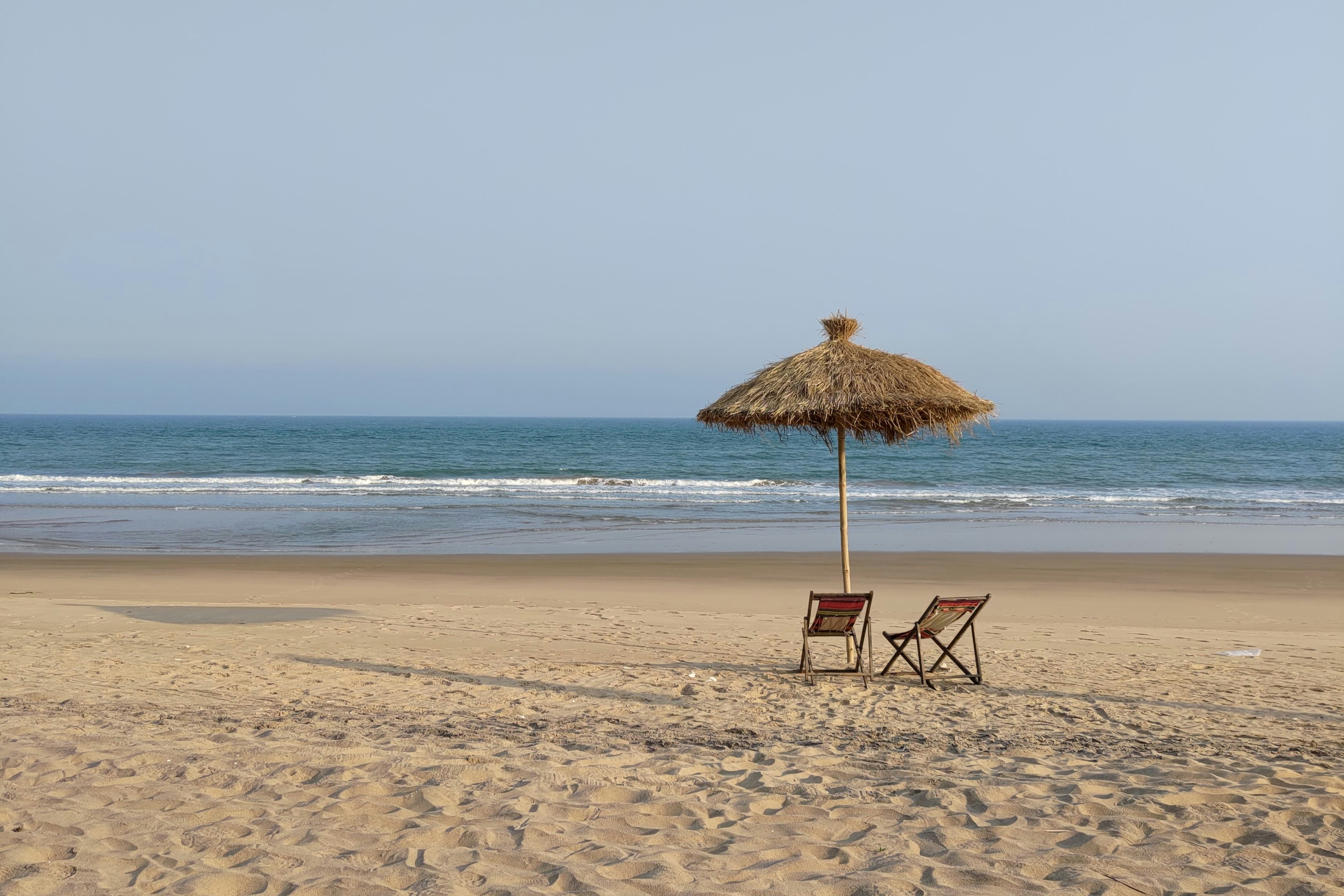woman wearing yellow long-sleeved dress under white clouds and blue sky during daytime