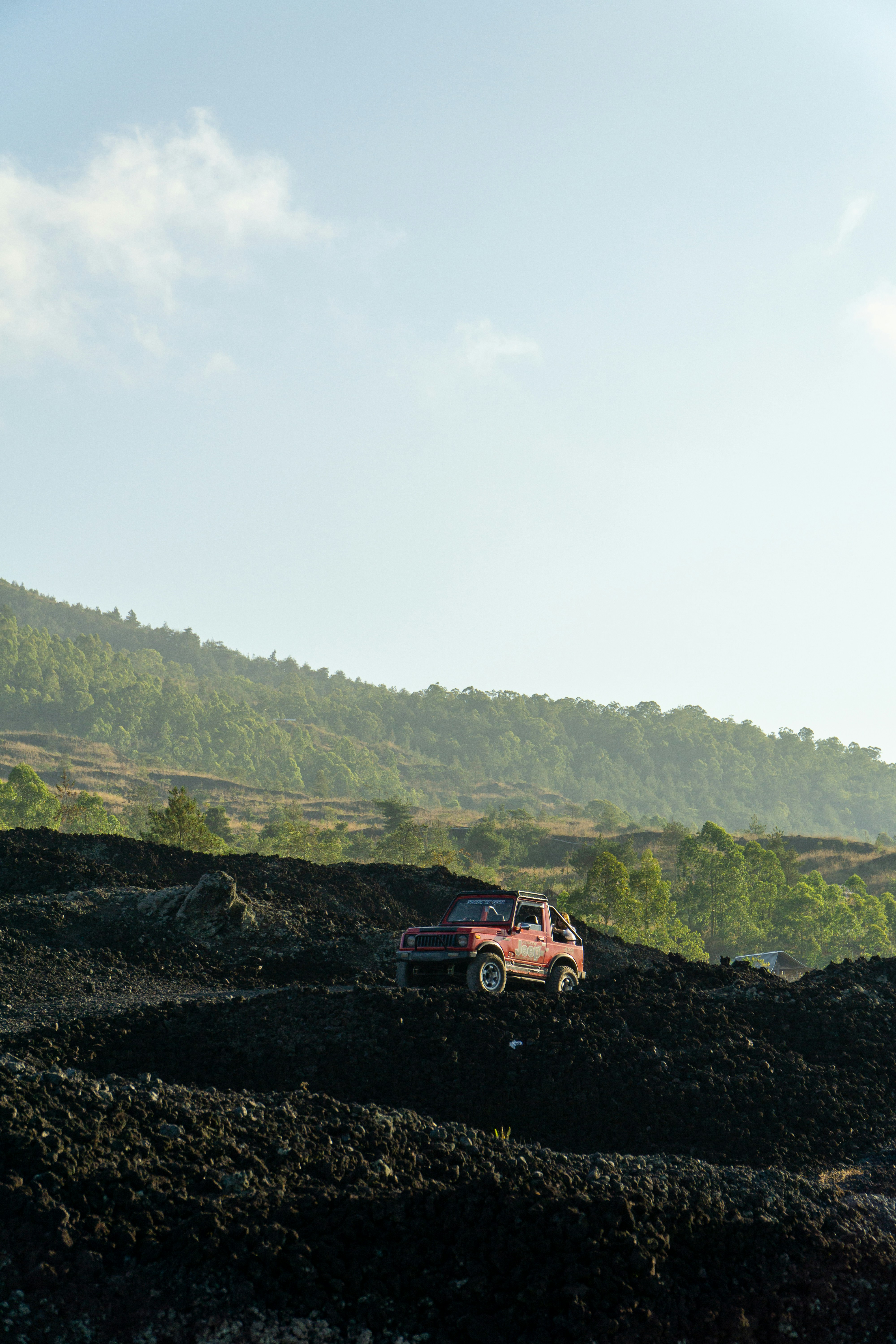 A truck is parked on a rocky hill