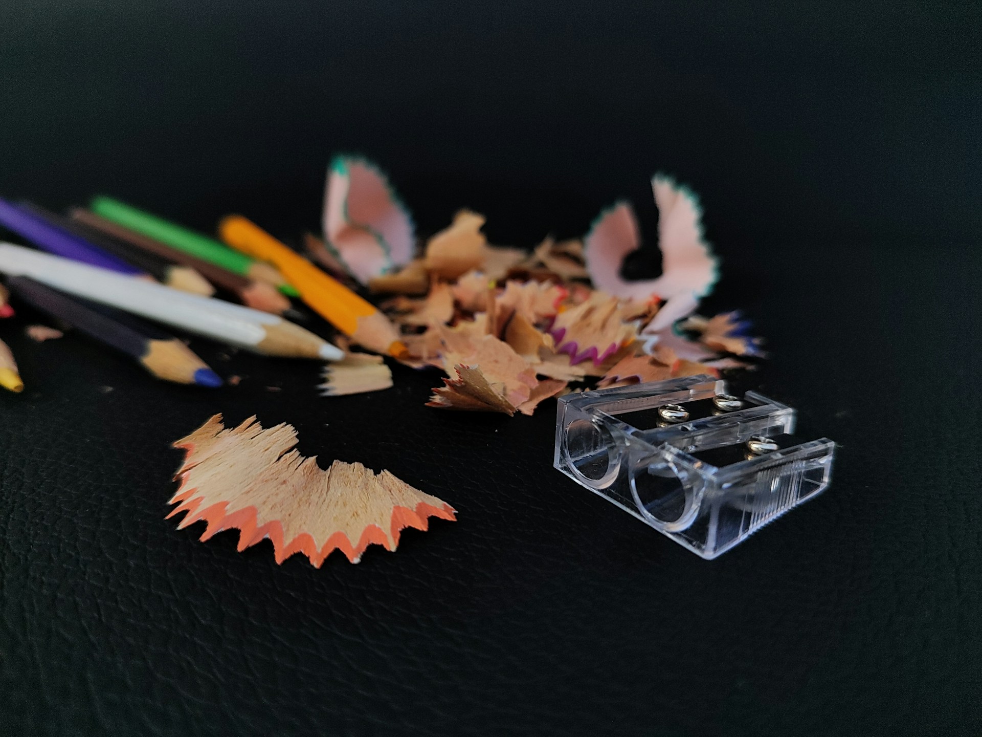 A group of pencils and sharpeners on a table