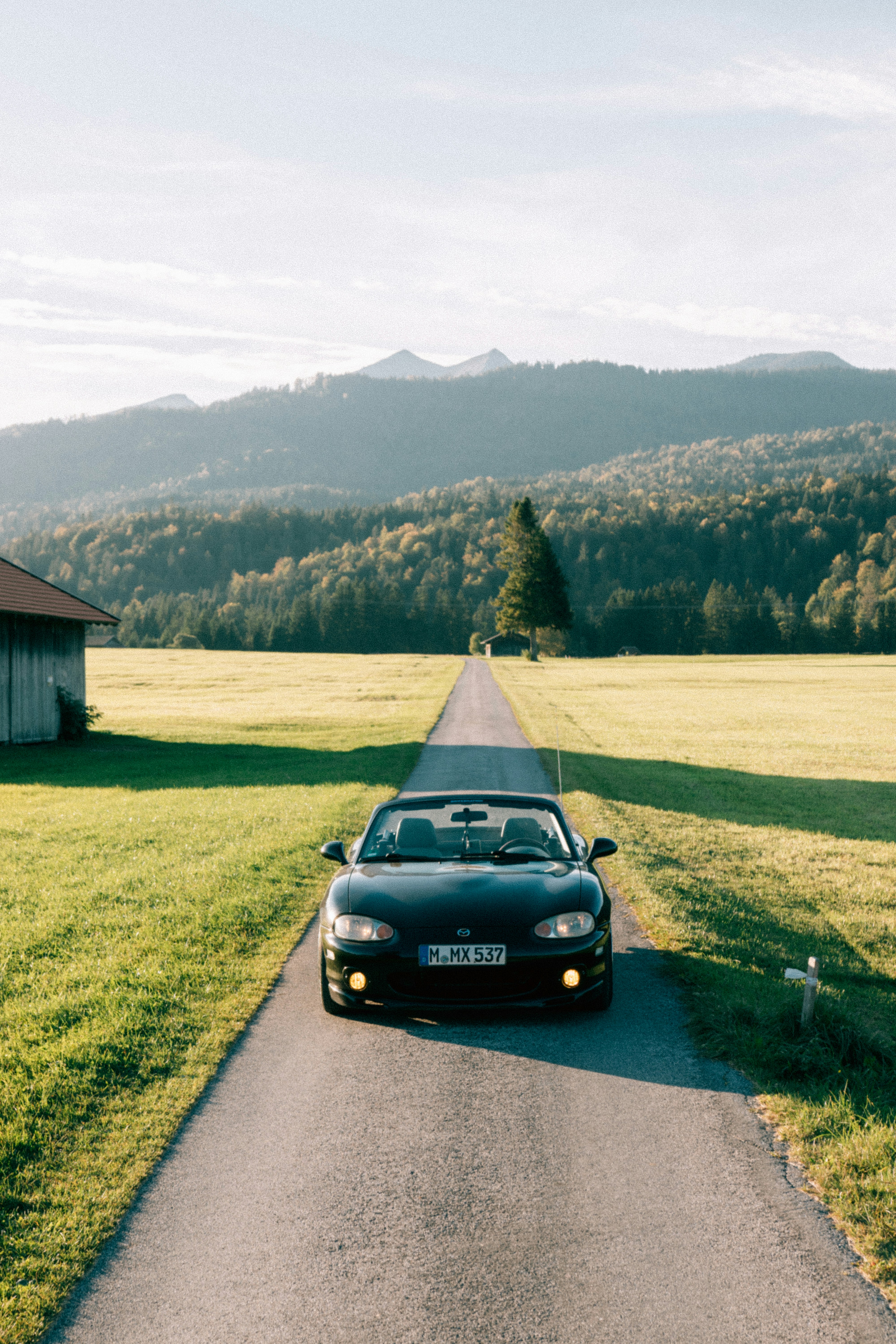 A car parked on the side of a road