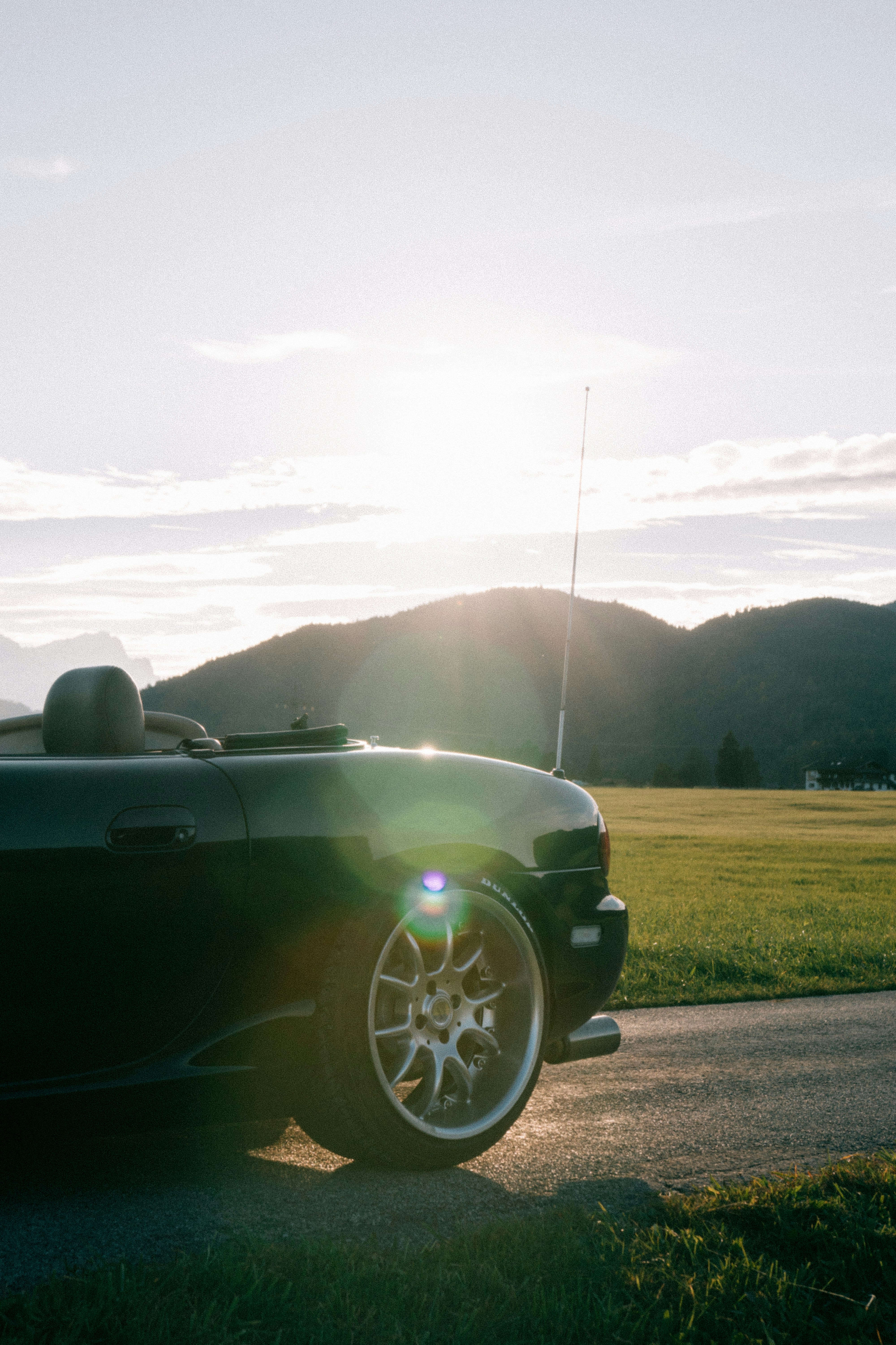 A black sports car parked on the side of the road