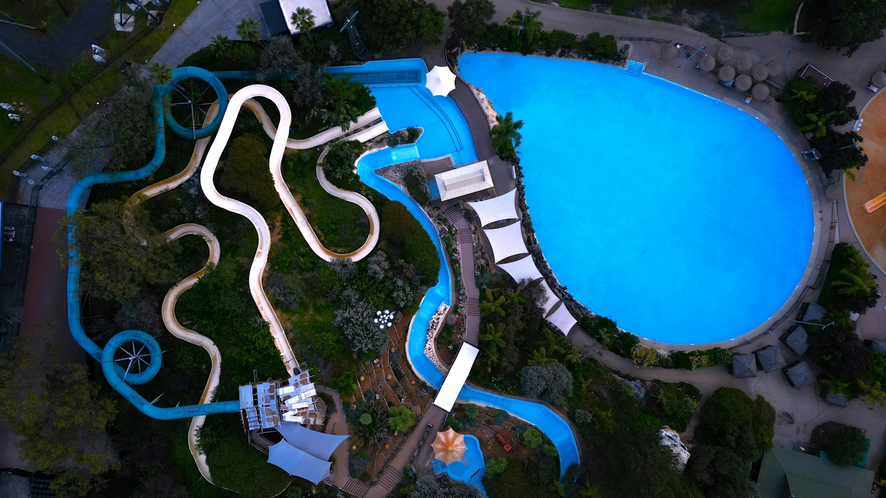 Water park pools and slides, illustrating commercial aquatic facilities
