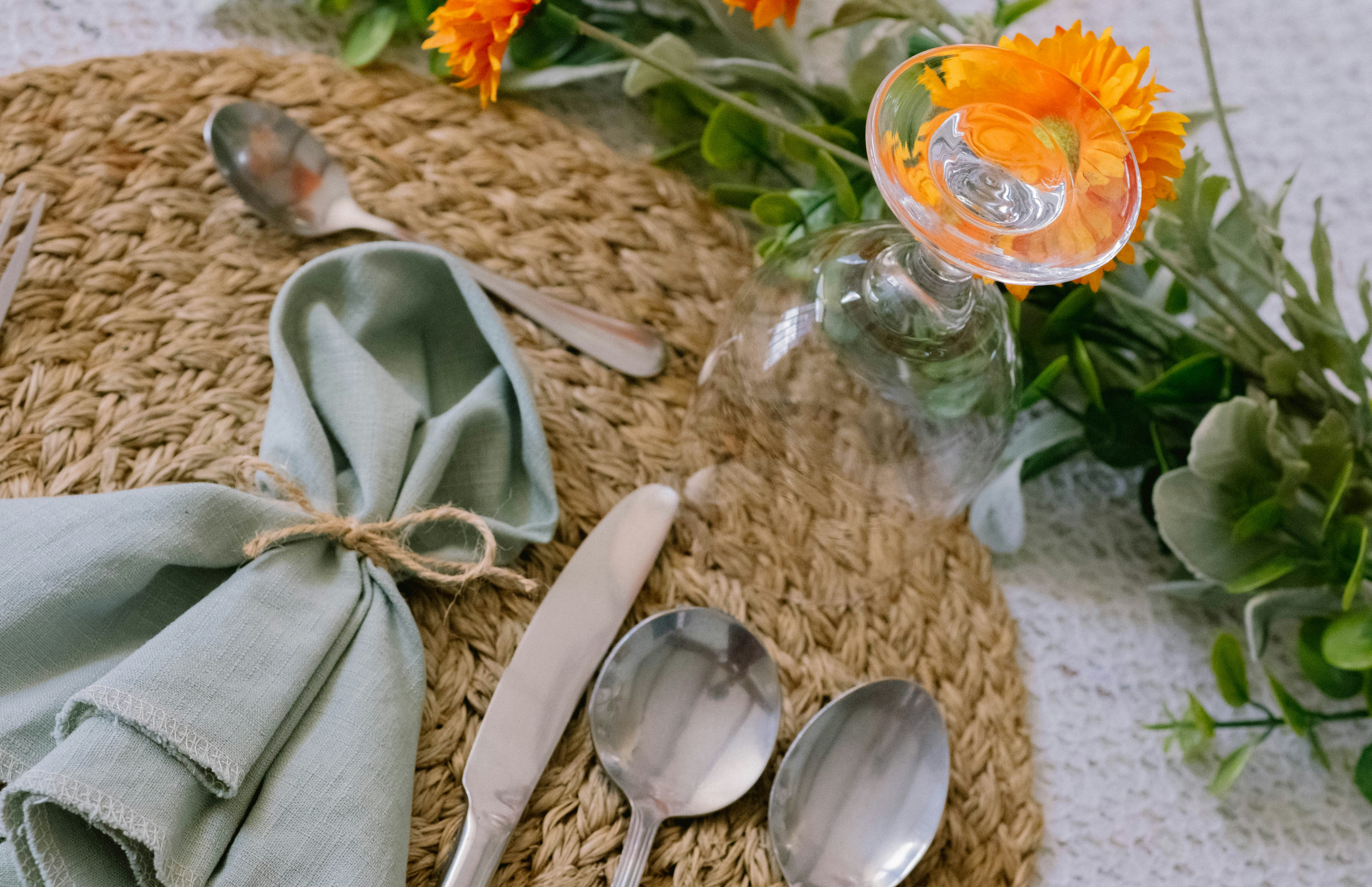 A place setting with flowers and silverware