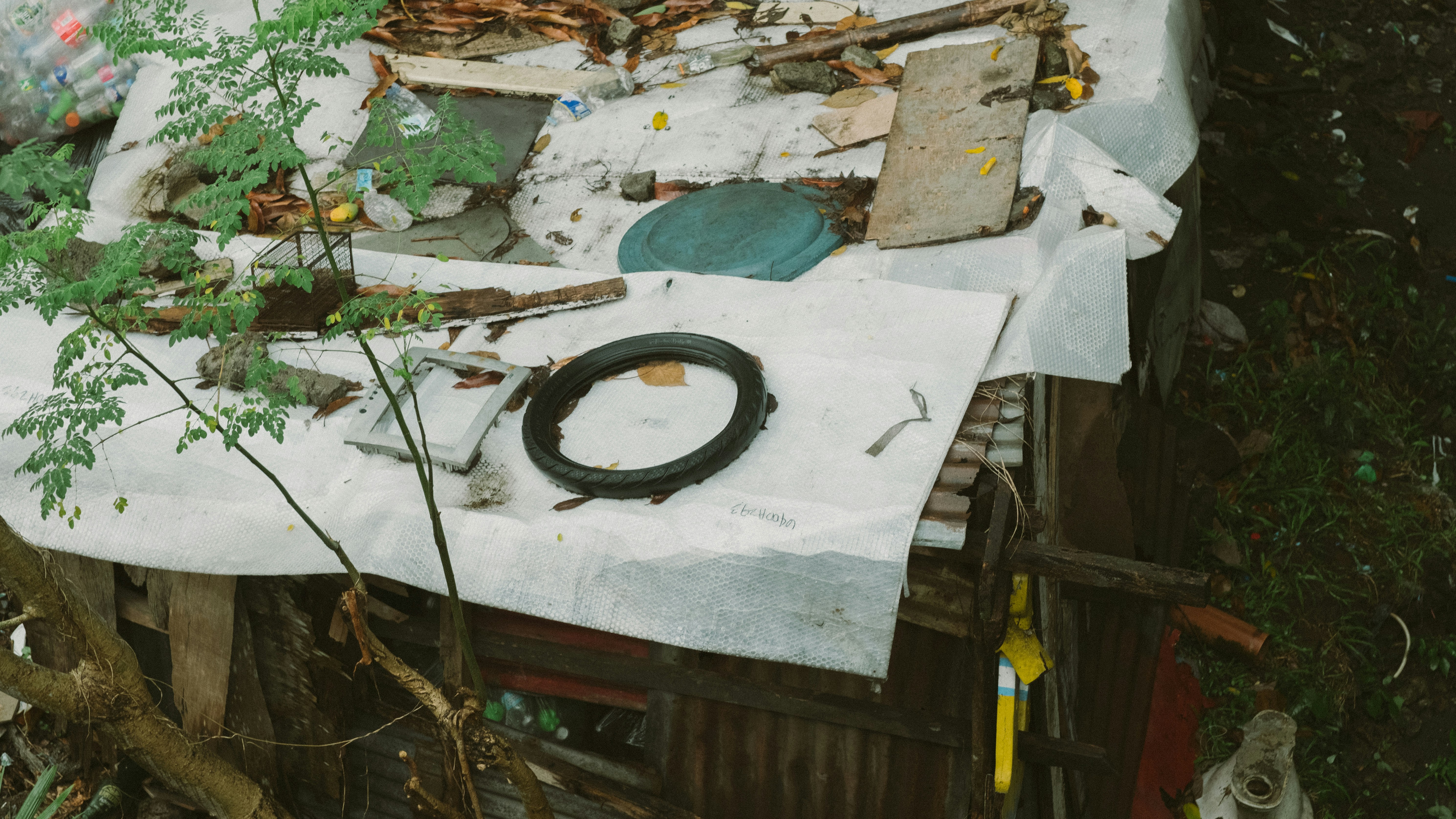 A pile of junk sitting on top of a wooden table