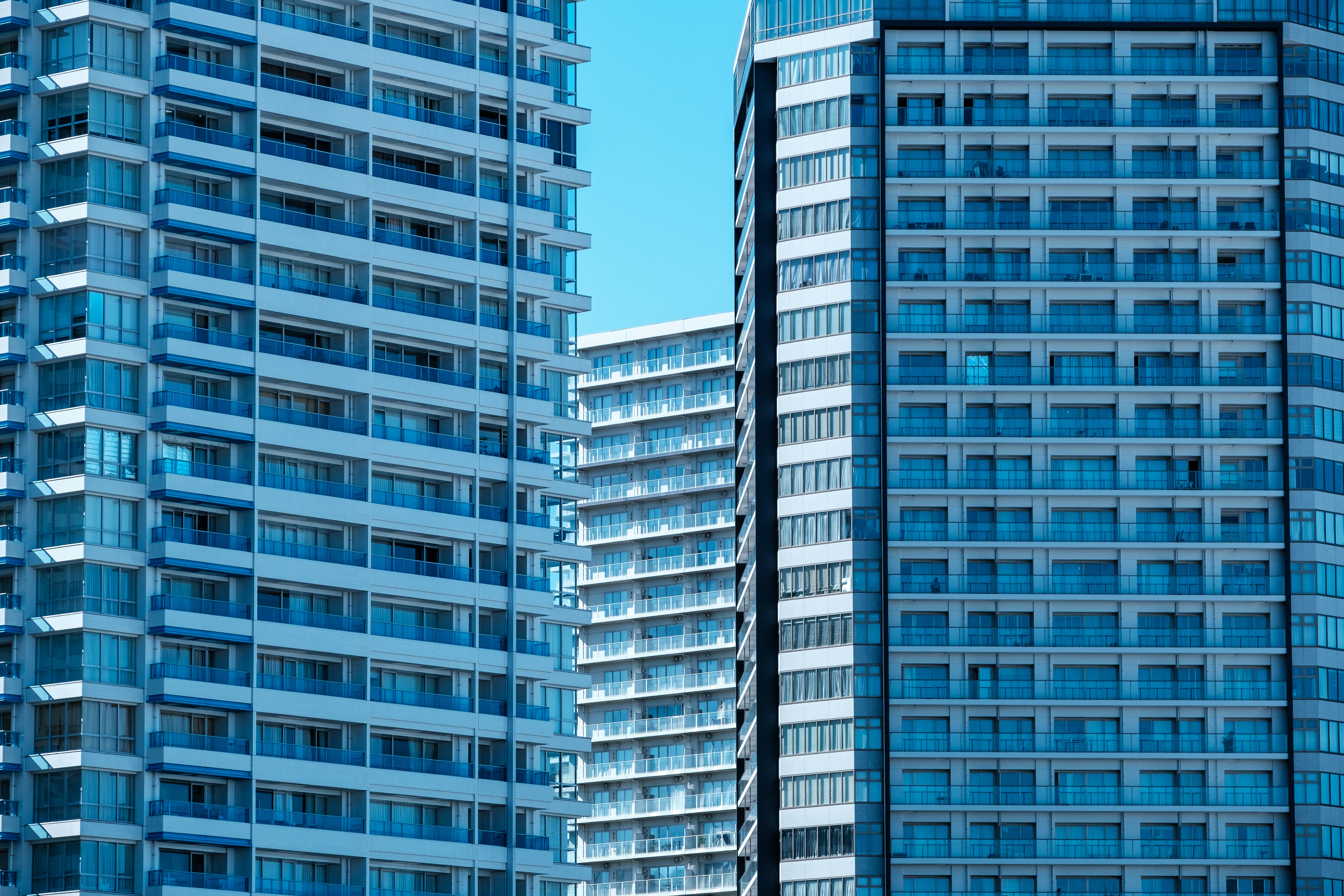 A couple of tall buildings sitting next to each other