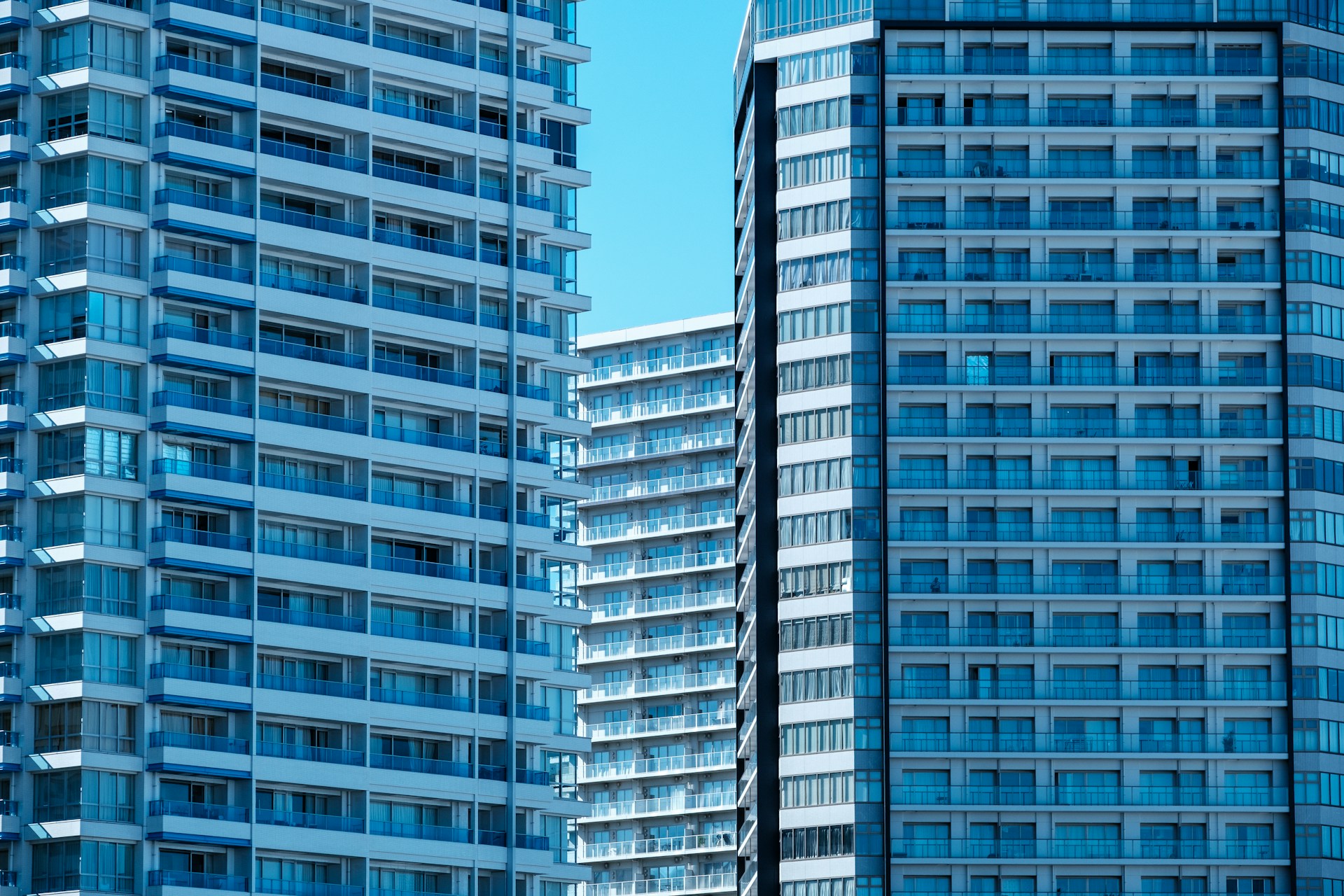 A couple of tall buildings sitting next to each other