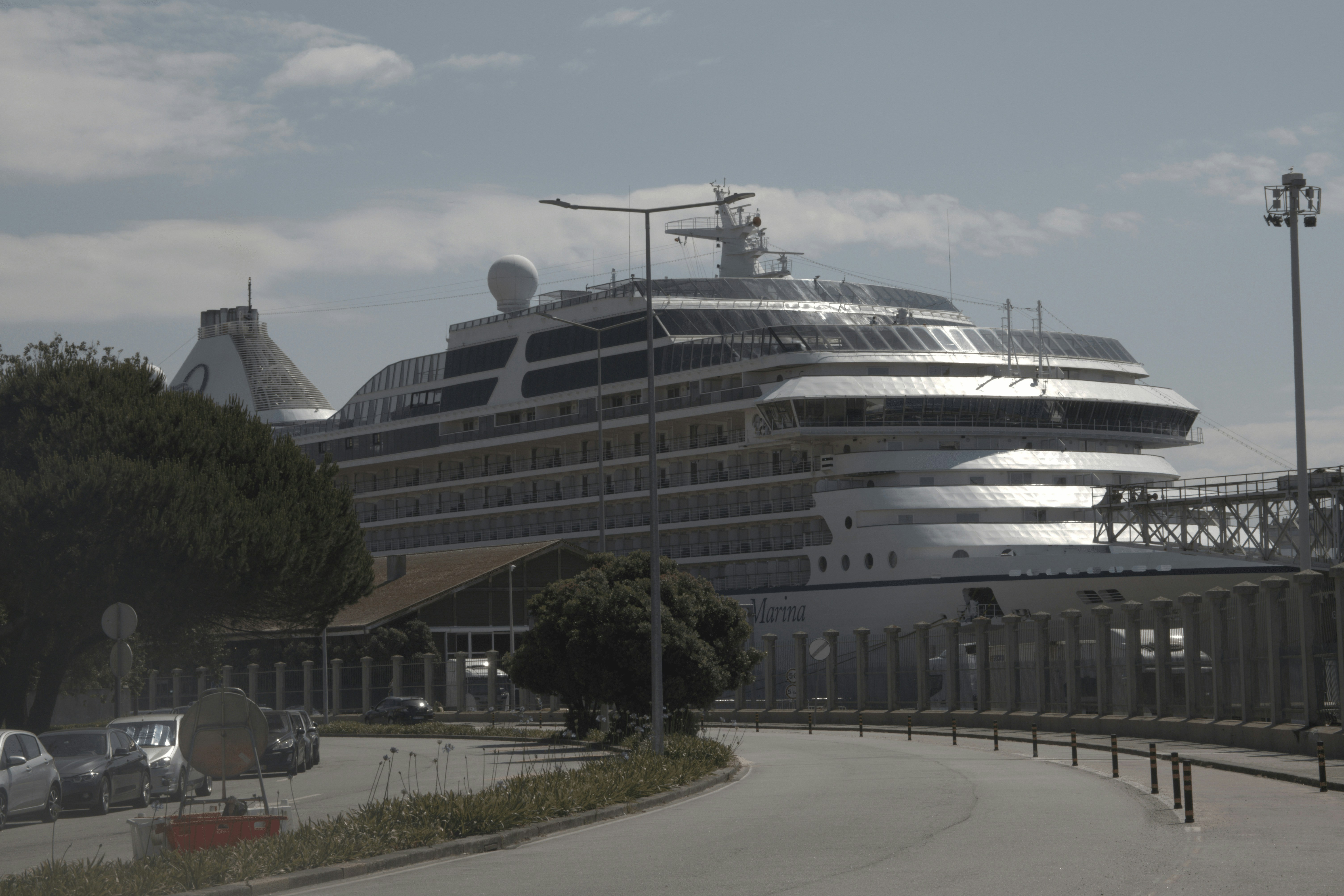 A large cruise ship docked in a harbor