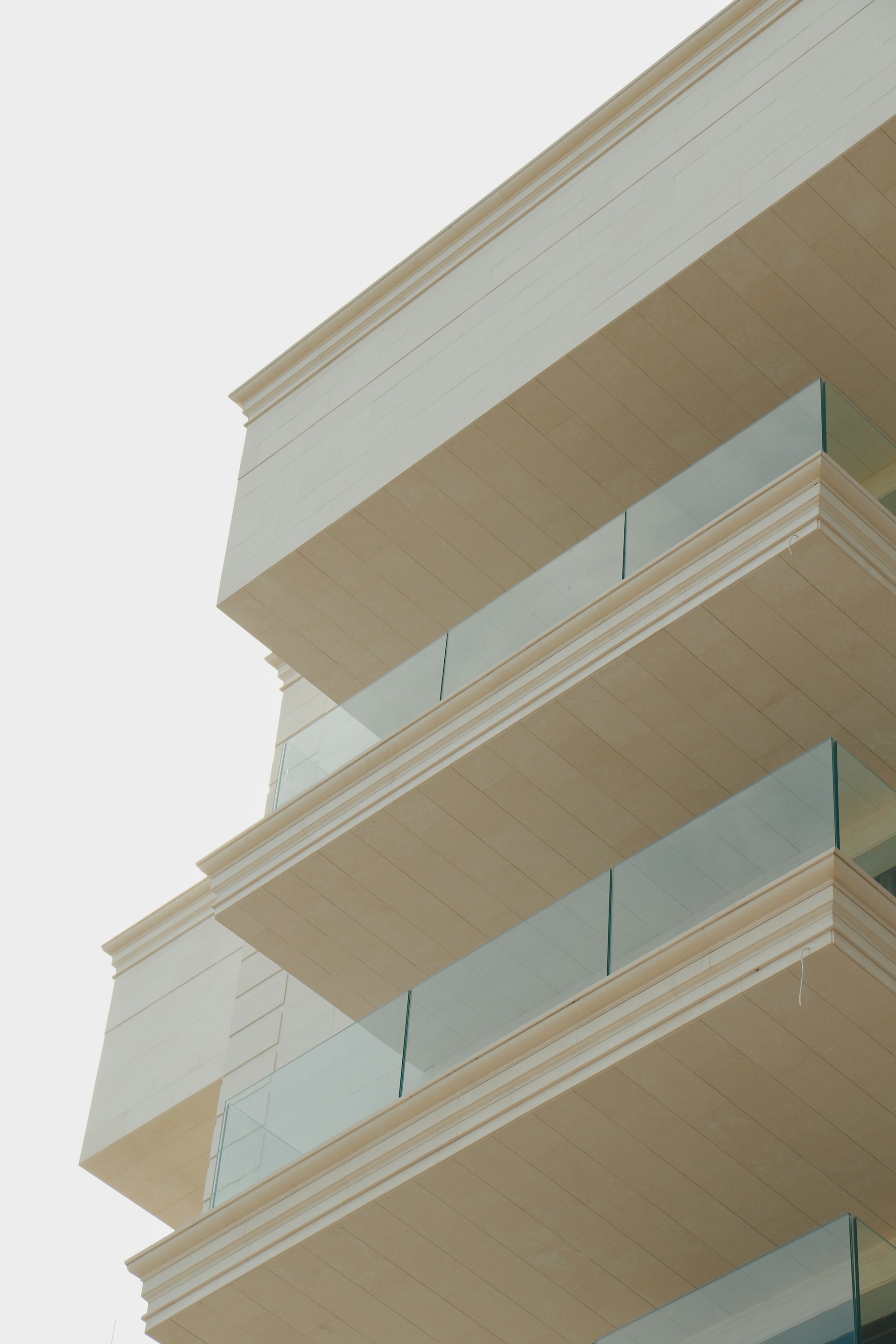 A tall building with balconies on the top of it