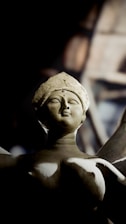 A statue of a woman holding a knife
