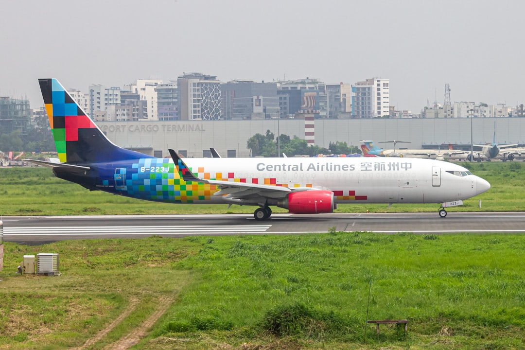 A colorful airplane is on the runway of an airport, Central Airlines B738