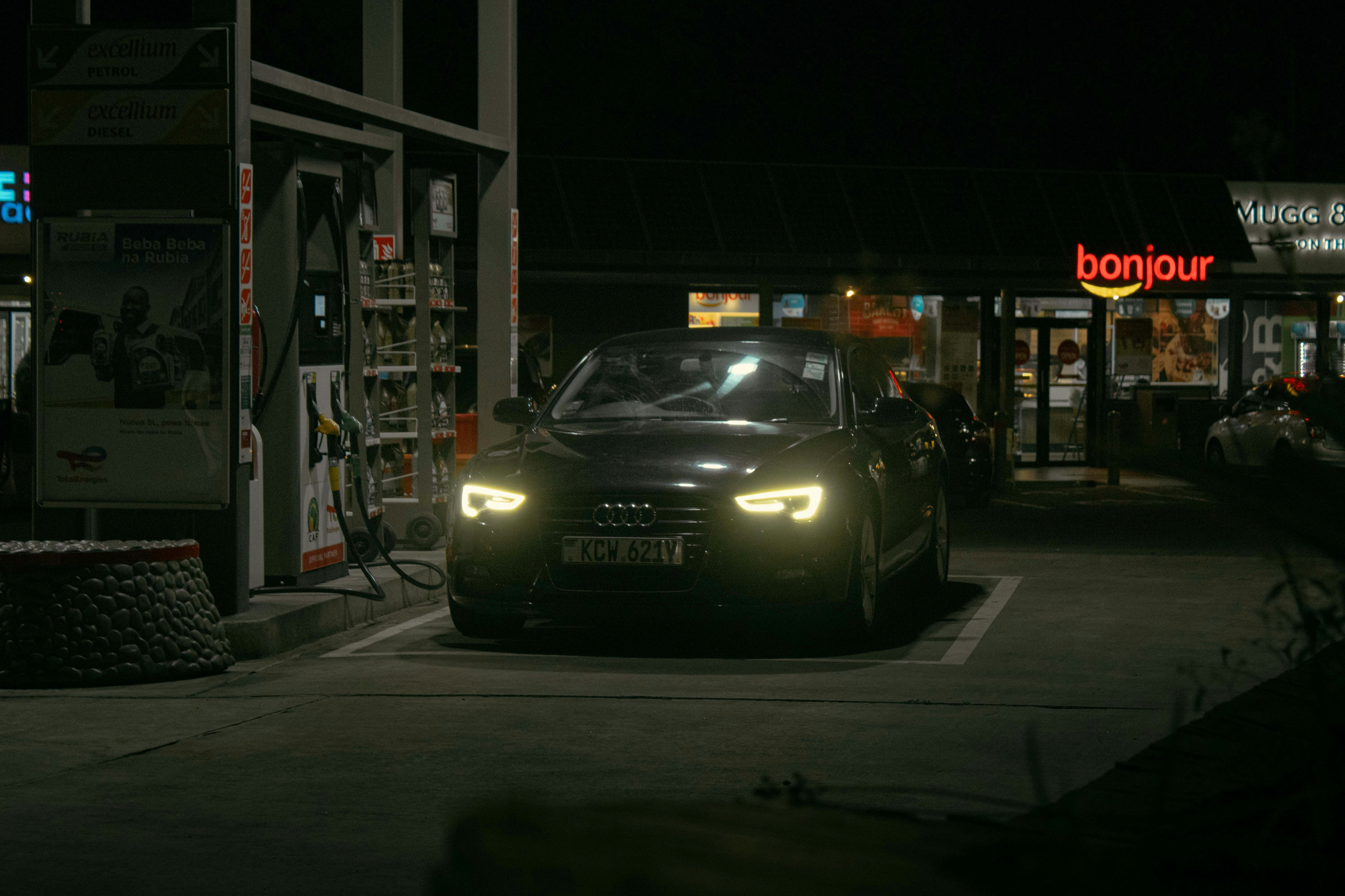 BMW i3 range extender model plugged in at a public charging station