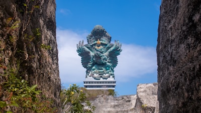 A statue in the middle of some rocks