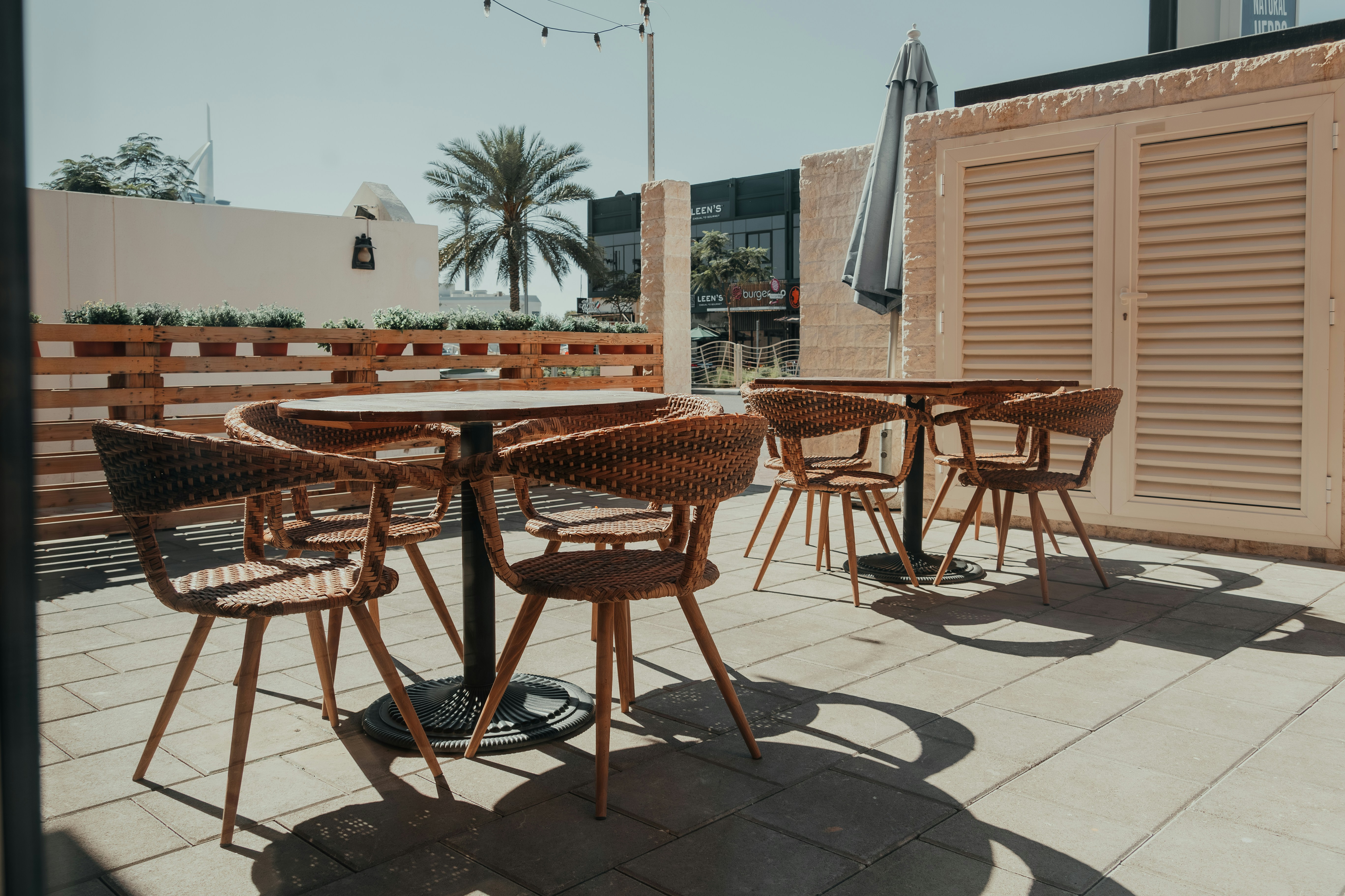 A group of tables and chairs sitting on a patio