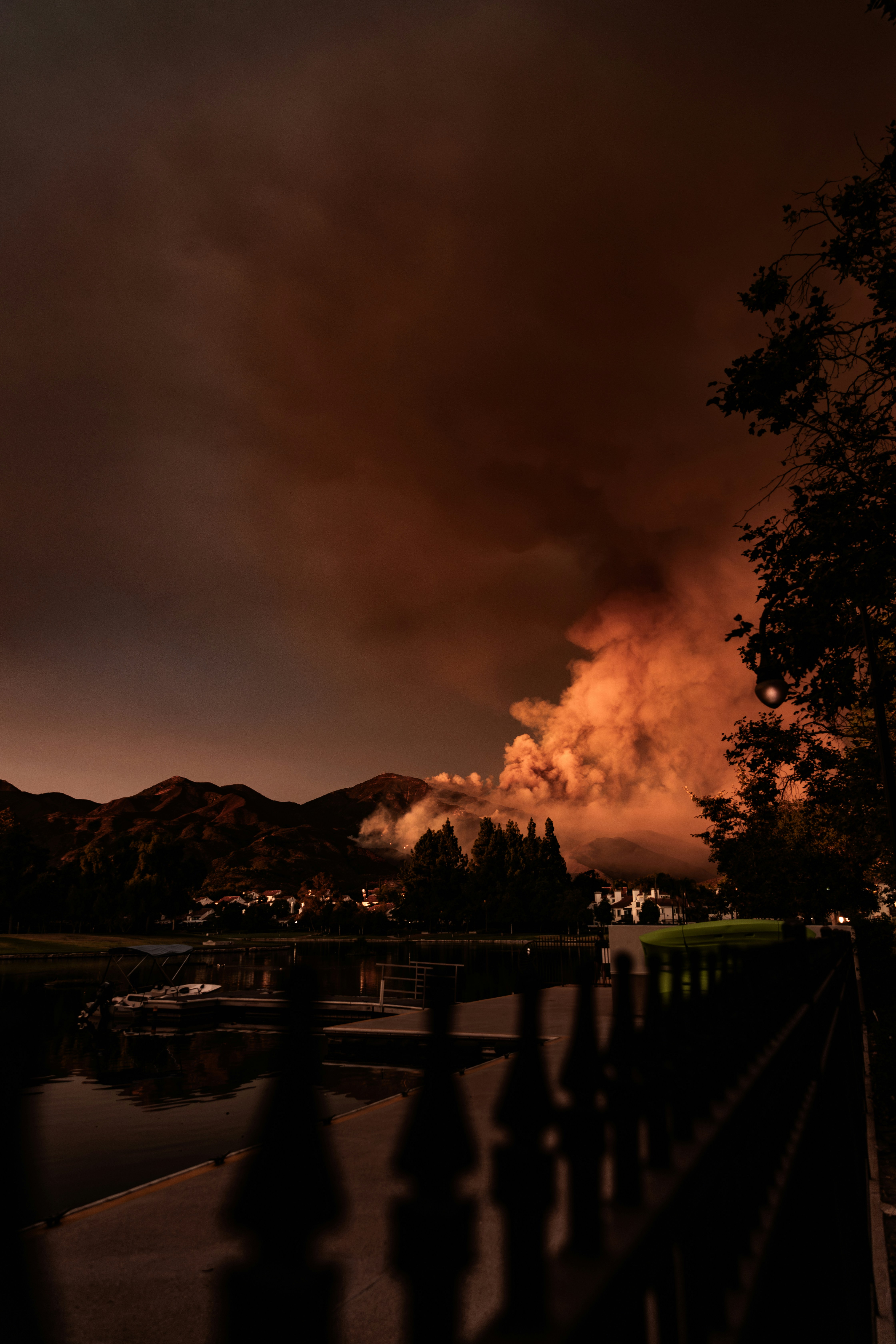 A large plume of smoke is seen in the distance