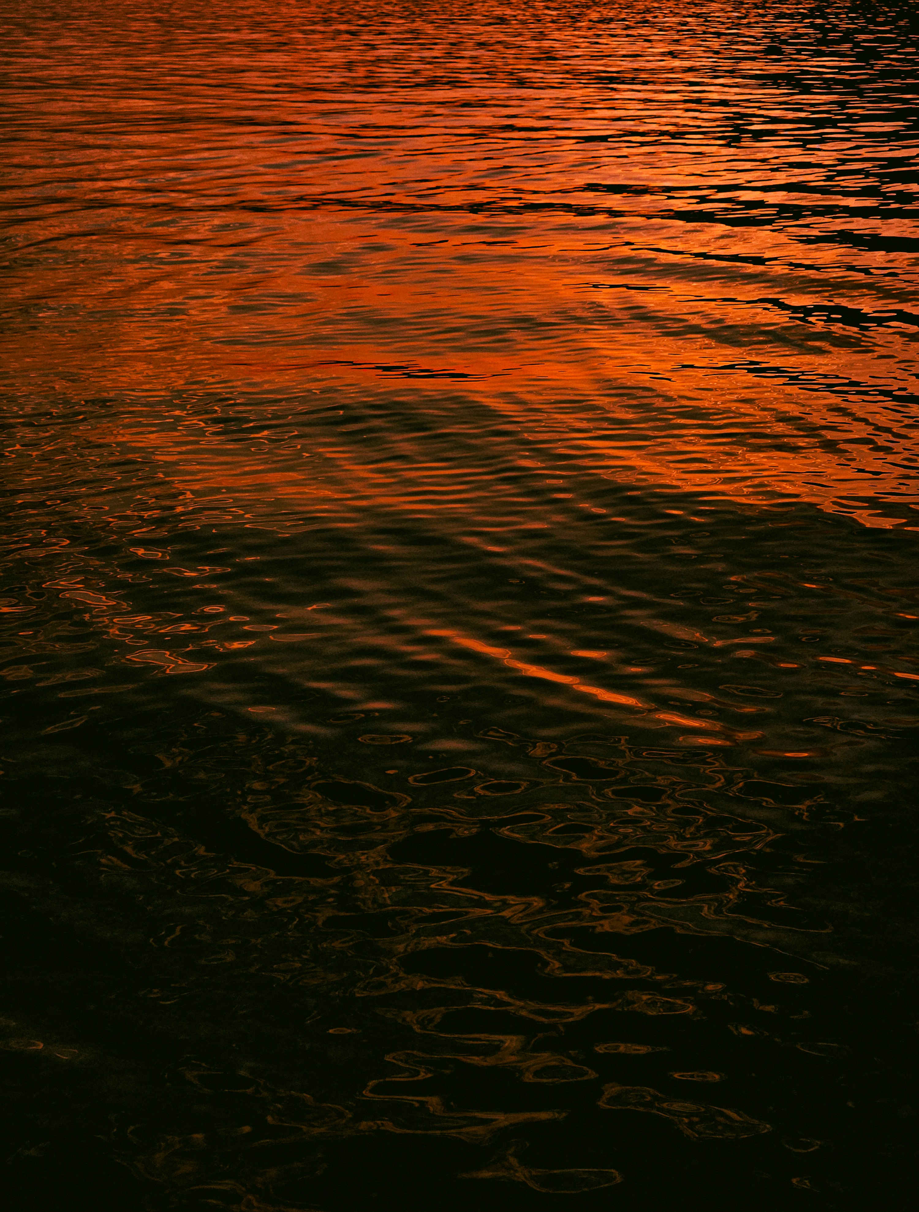 A boat floating on top of a body of water