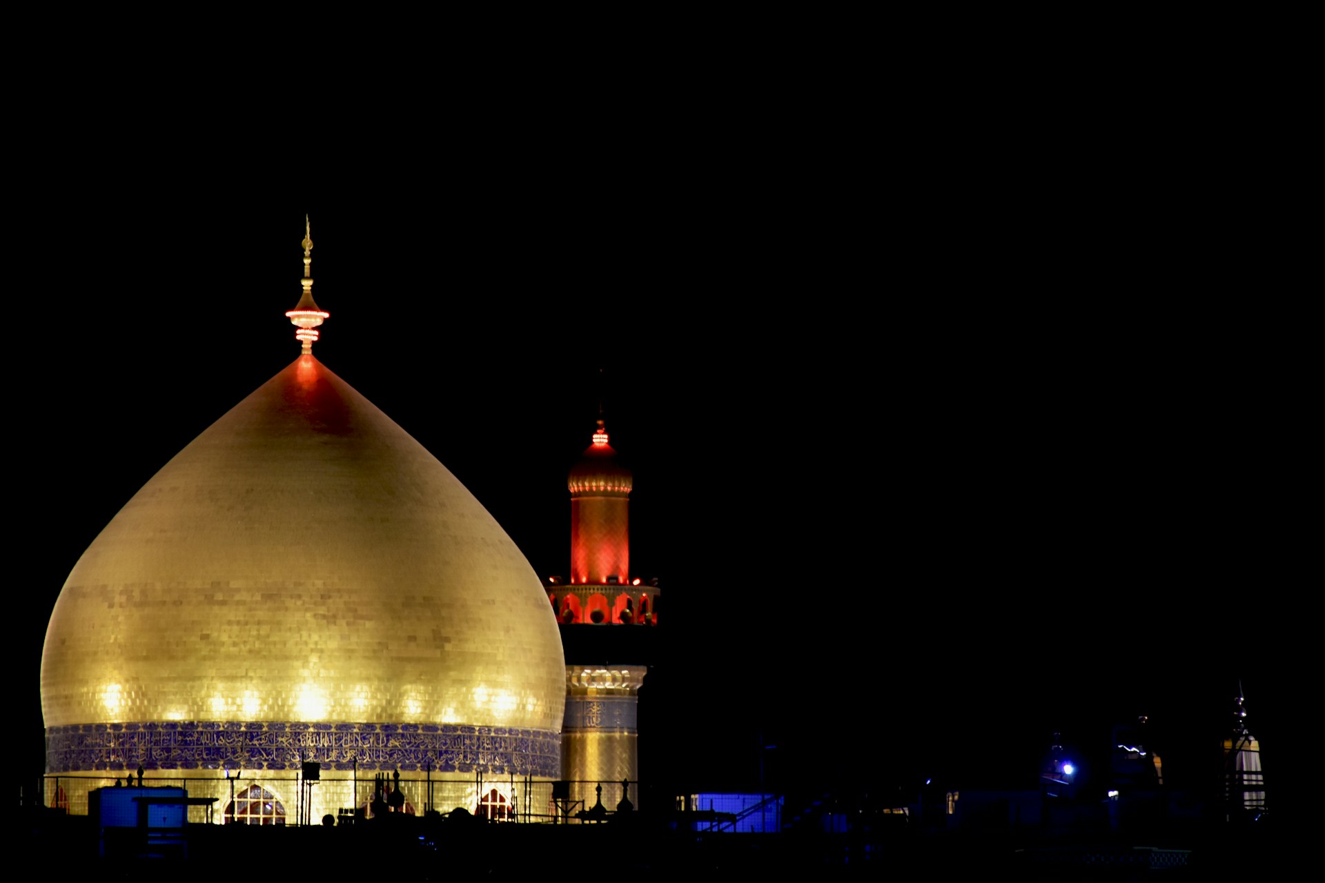 A large white building with a red light on top of it