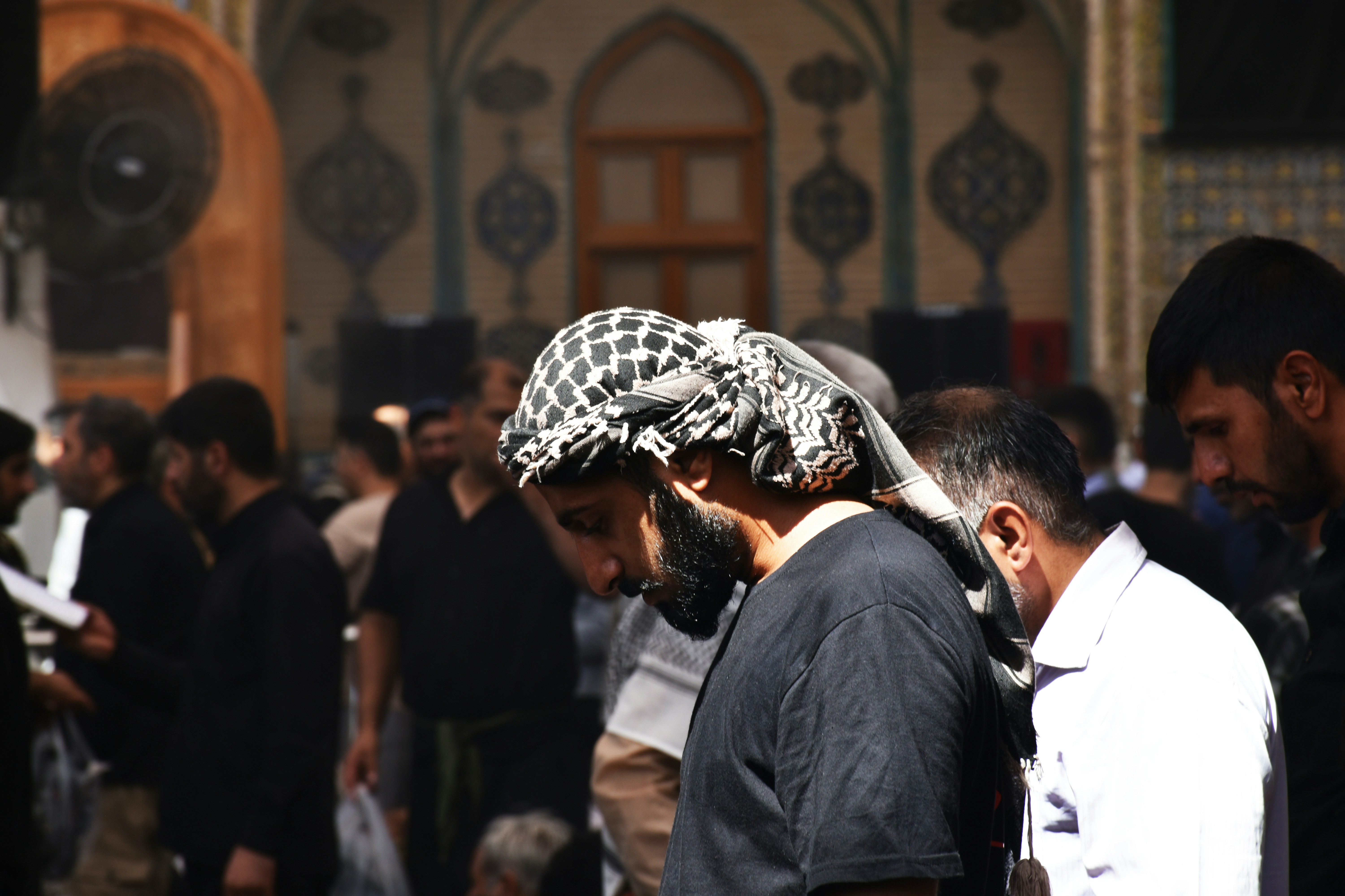 A group of people standing around each other