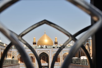 A view of a building through a fence