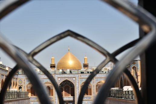 A view of a building through a fence