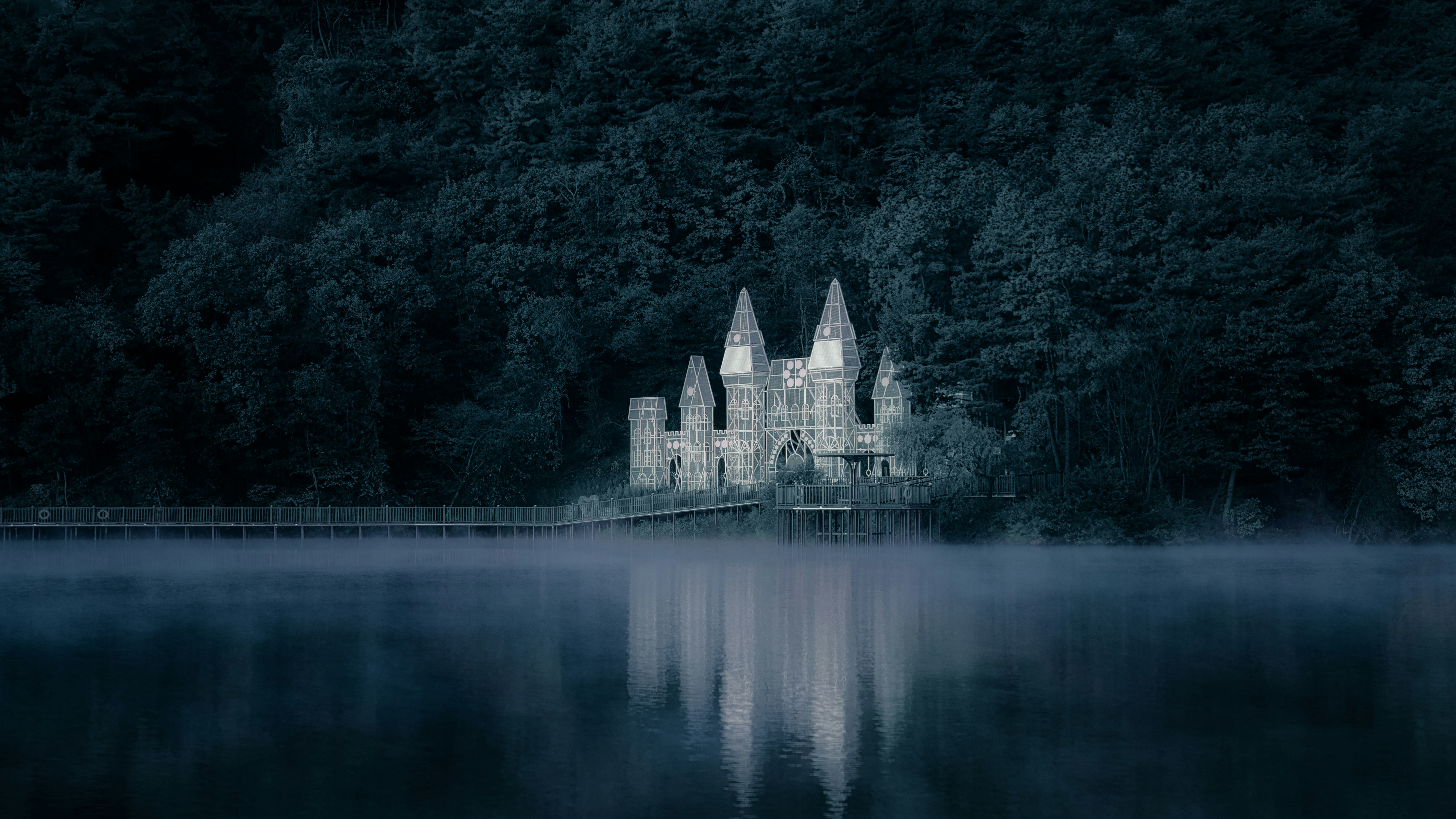 A castle in the middle of a lake at night photo – Free Building Image ...