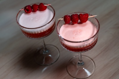 Two desserts sitting on top of a wooden table