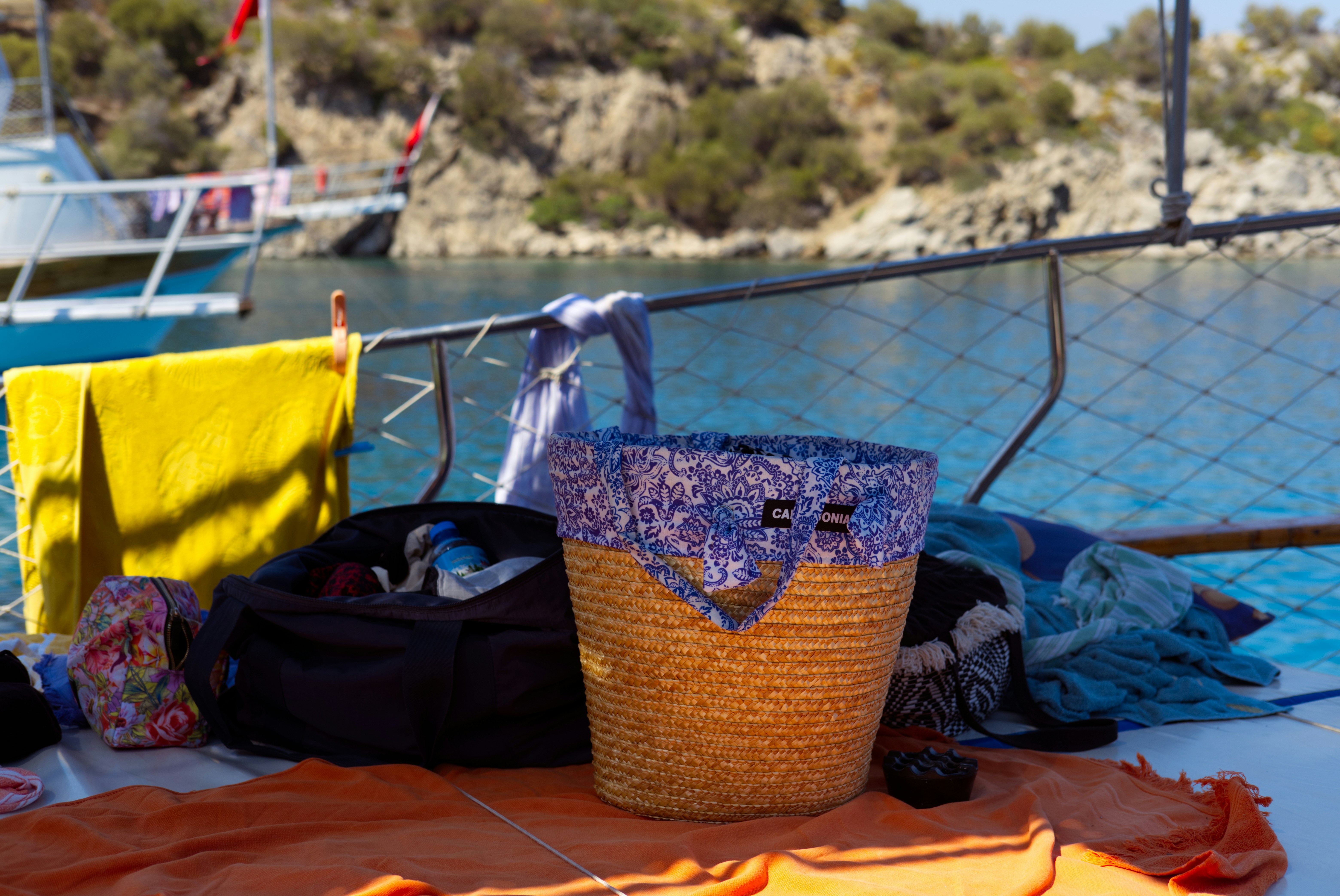 A basket sitting on top of a table next to a body of water