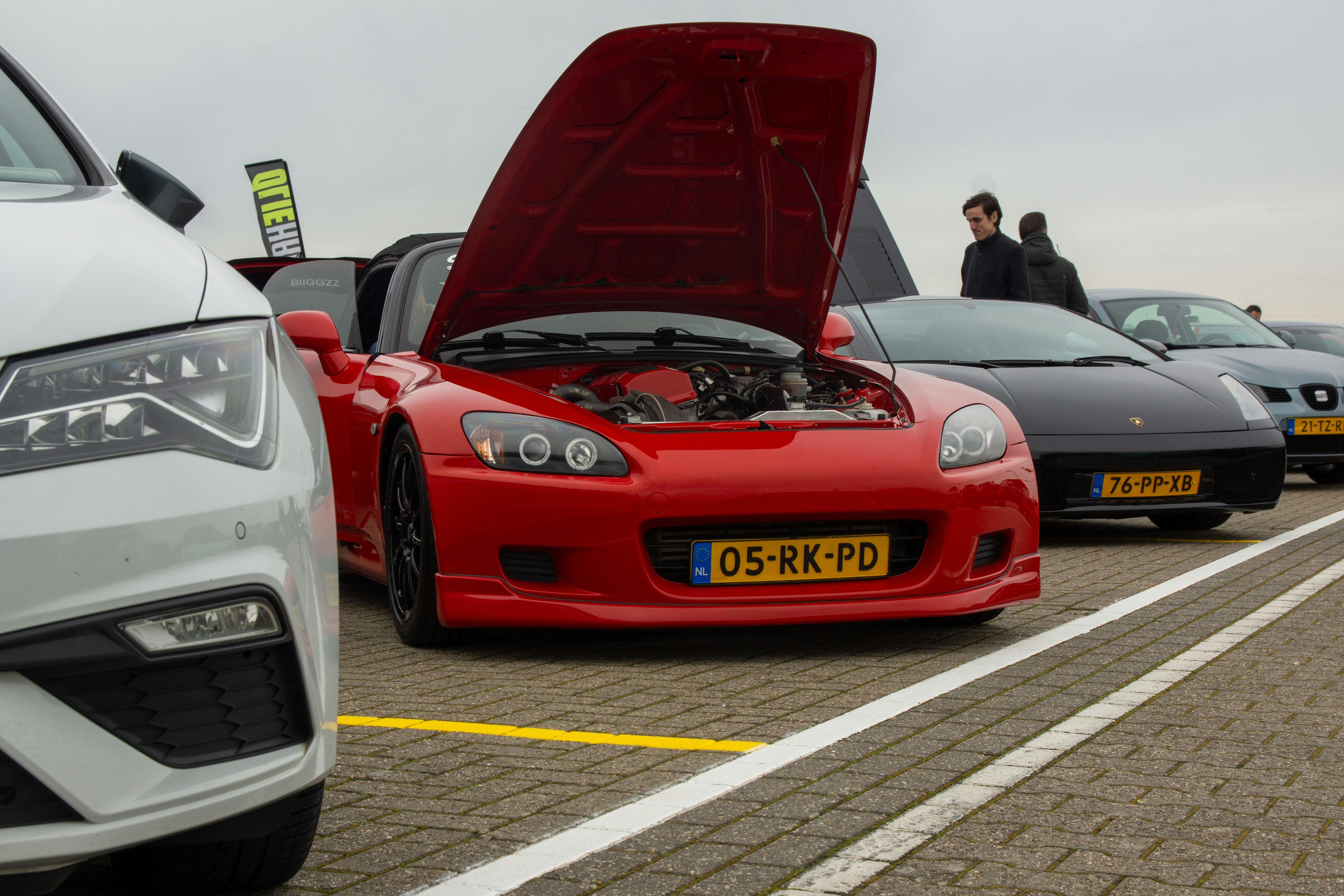 A group of cars parked next to each other