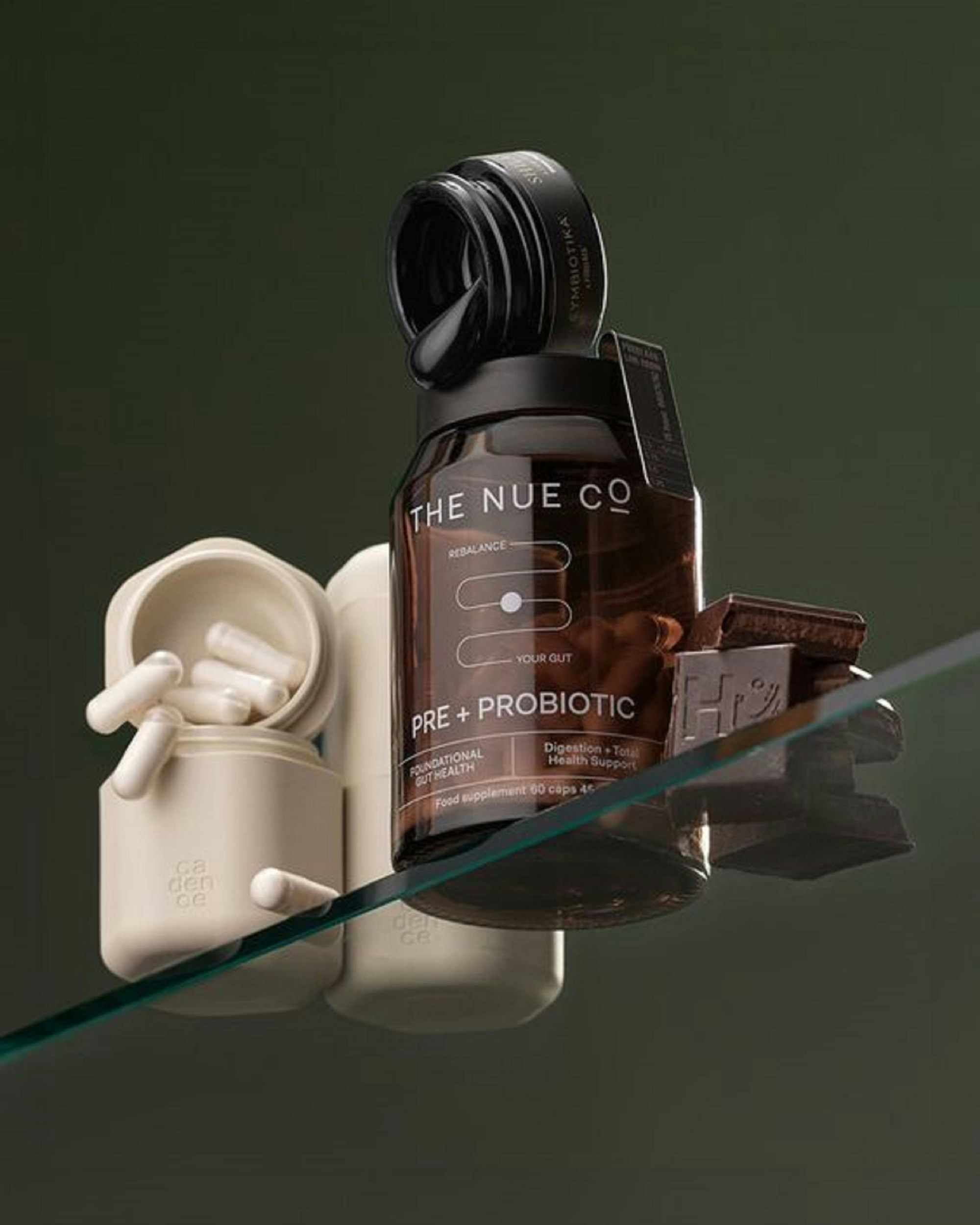 A bottle of the nue co on a glass table