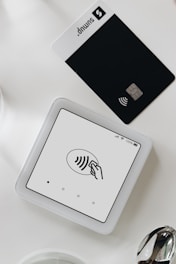 A smart phone sitting on top of a white table