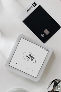 A smart phone sitting on top of a white table