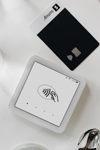 A smart phone sitting on top of a white table