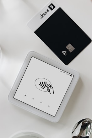 A smart phone sitting on top of a white table