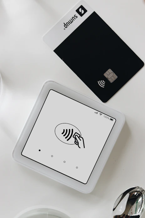 A smart phone sitting on top of a white table