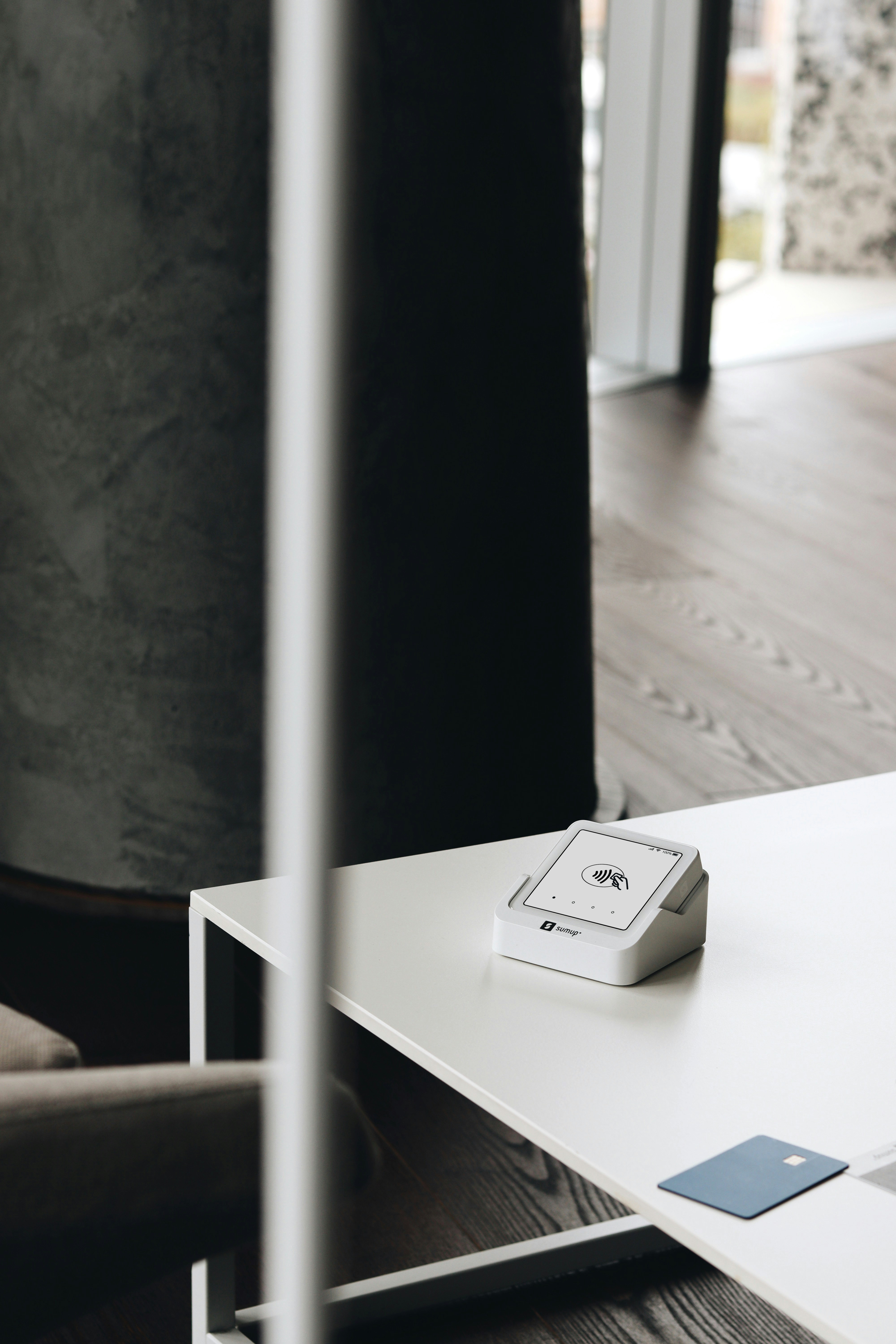 A remote control sitting on top of a white table
