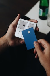 A person holding a smart phone in their hand