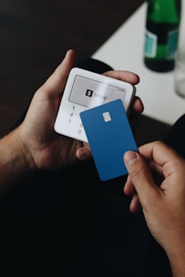 A person holding a smart phone in their hand