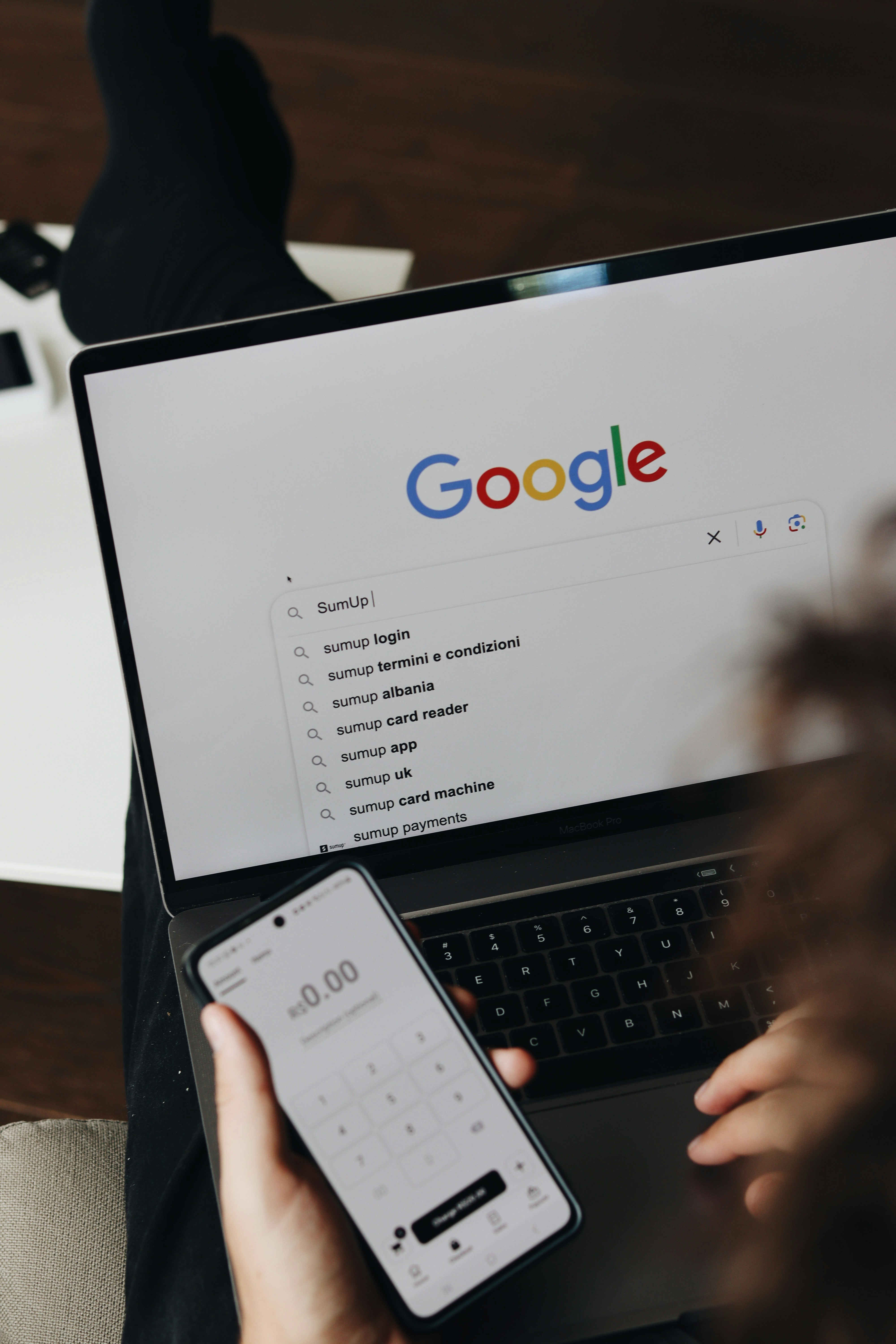 A person is using a laptop to search for 