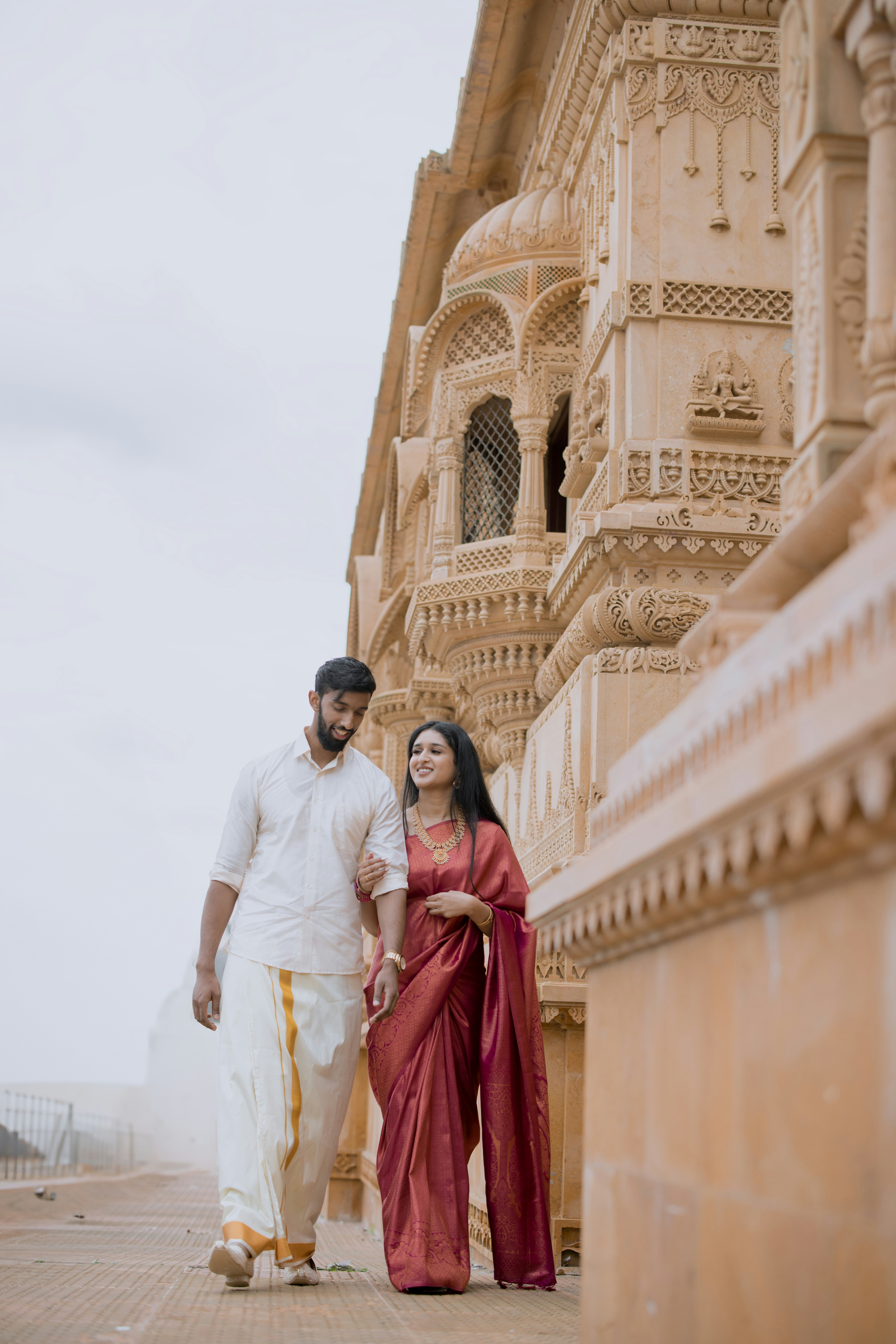 A man and a woman walking down a street